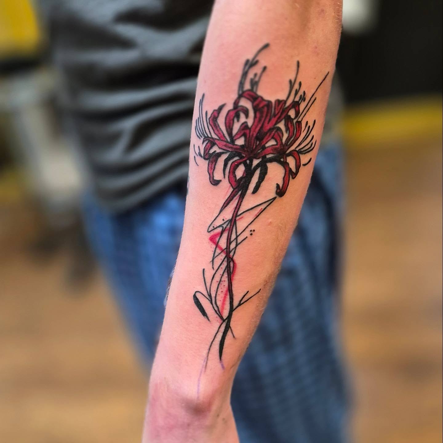 Lily dotwork tattoo on the forearm by Bobby H