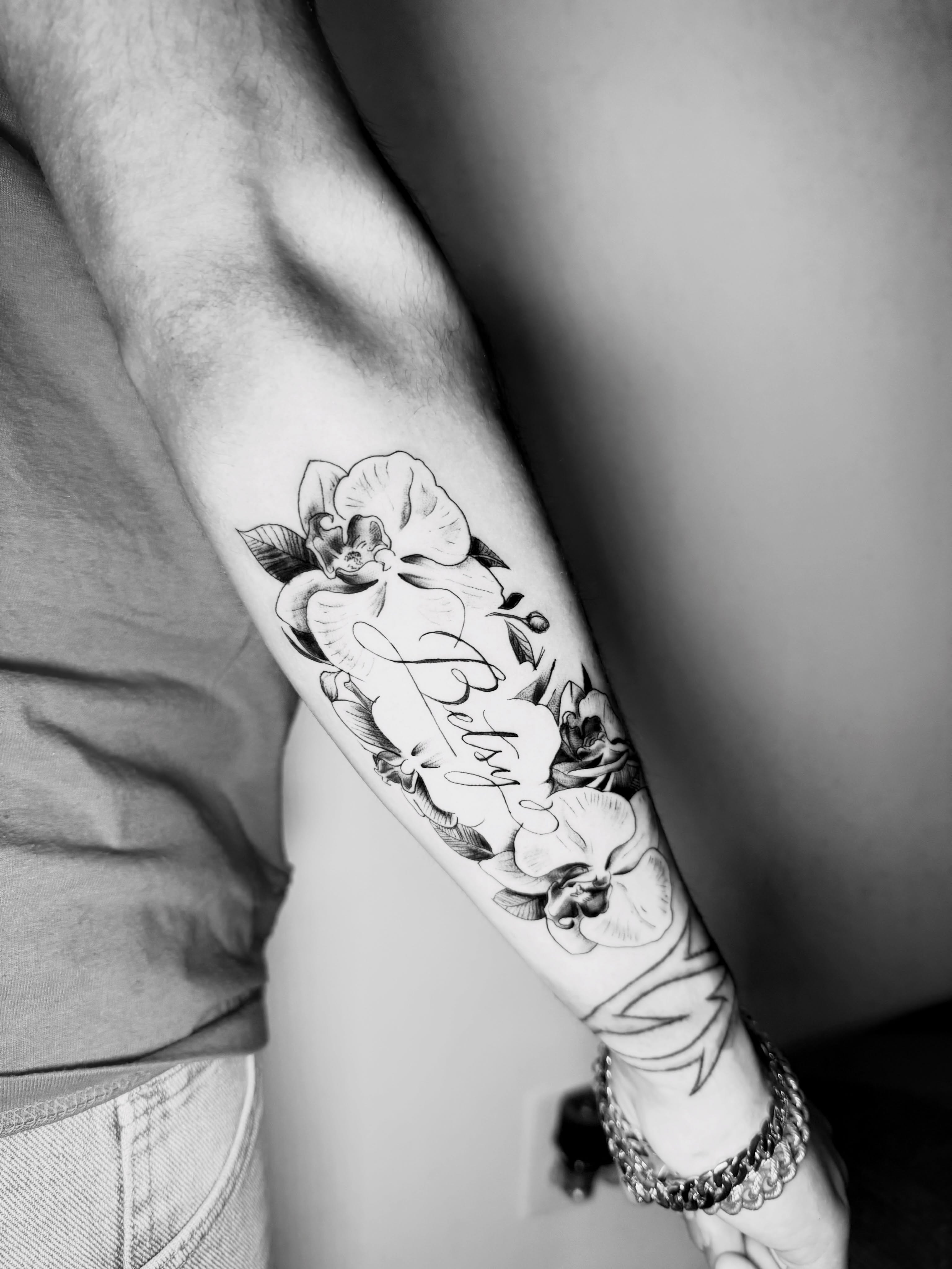 Floral arrangement realism tattoo on the forearm by Sebastian martinez, Memphis, Tennessee