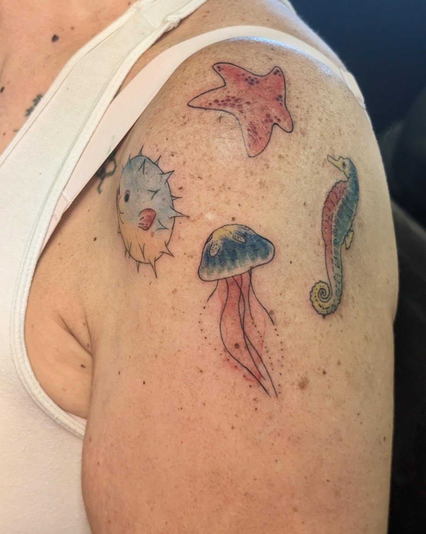 Sea creatures watercolor tattoo on the shoulder by Ari 💠🧜‍♂️🐟🎨🦑🐚💠
