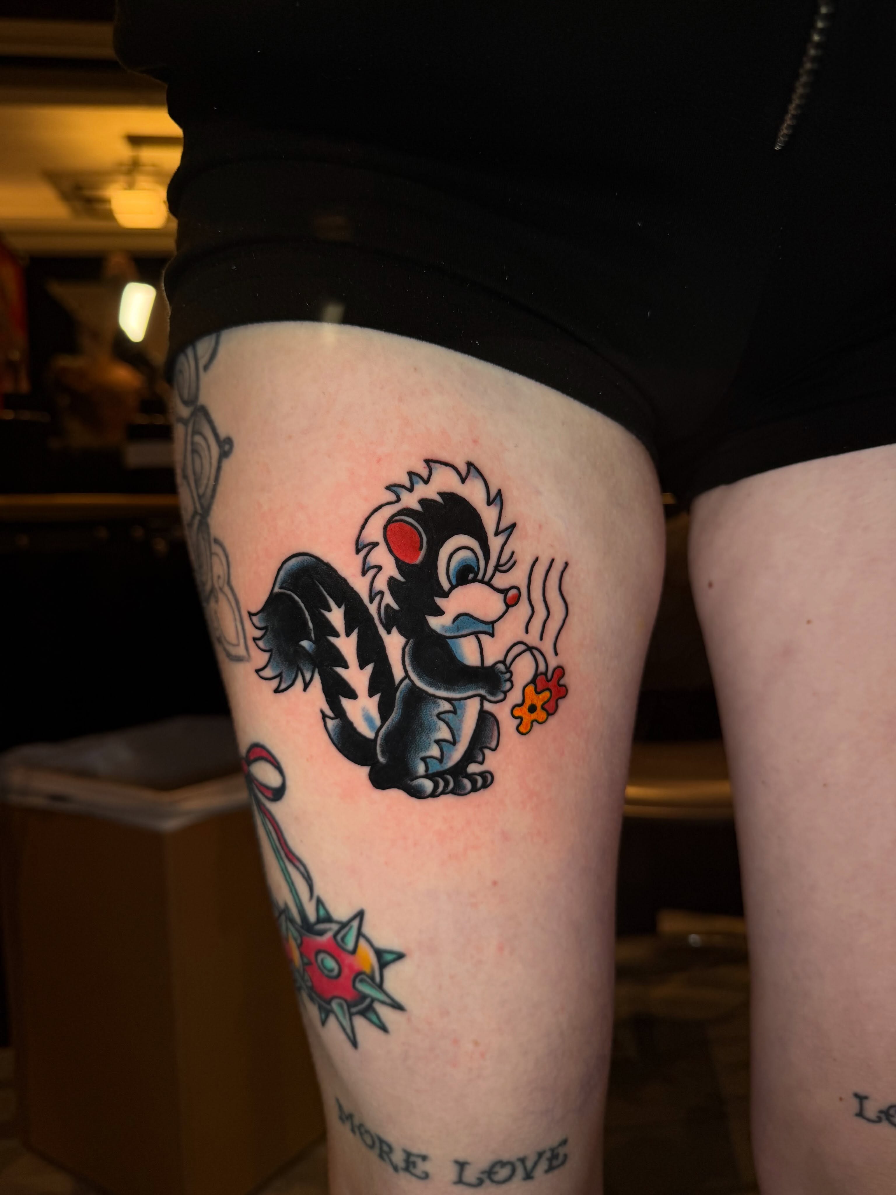 Skunk American traditional tattoo on the forearm by Dustie Pitstick