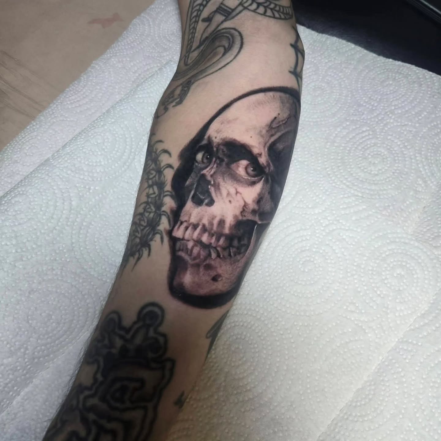 Skull realism tattoo on the forearm by Ema Fish