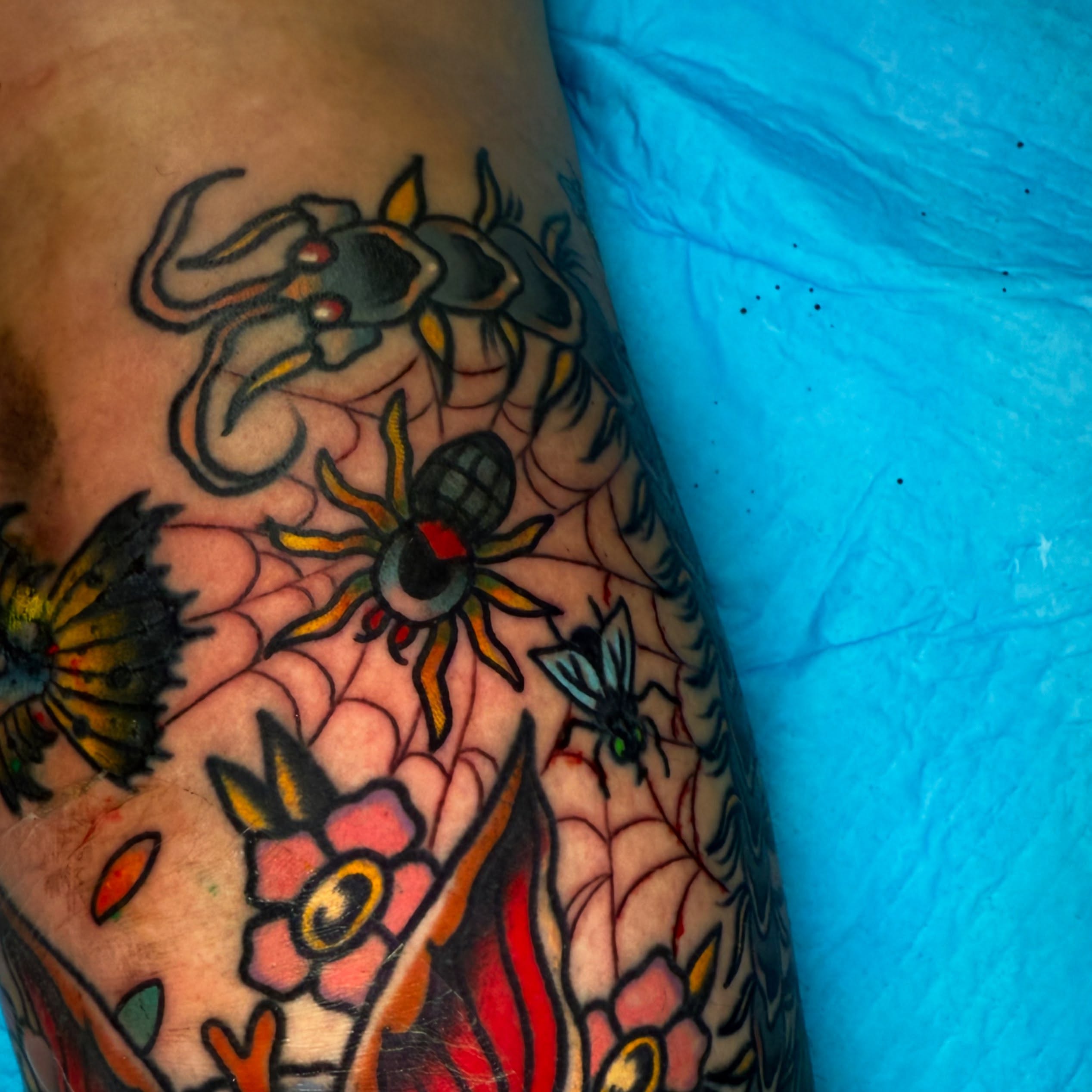 Spider and flowers American traditional tattoo on the forearm by Arron Albaugh