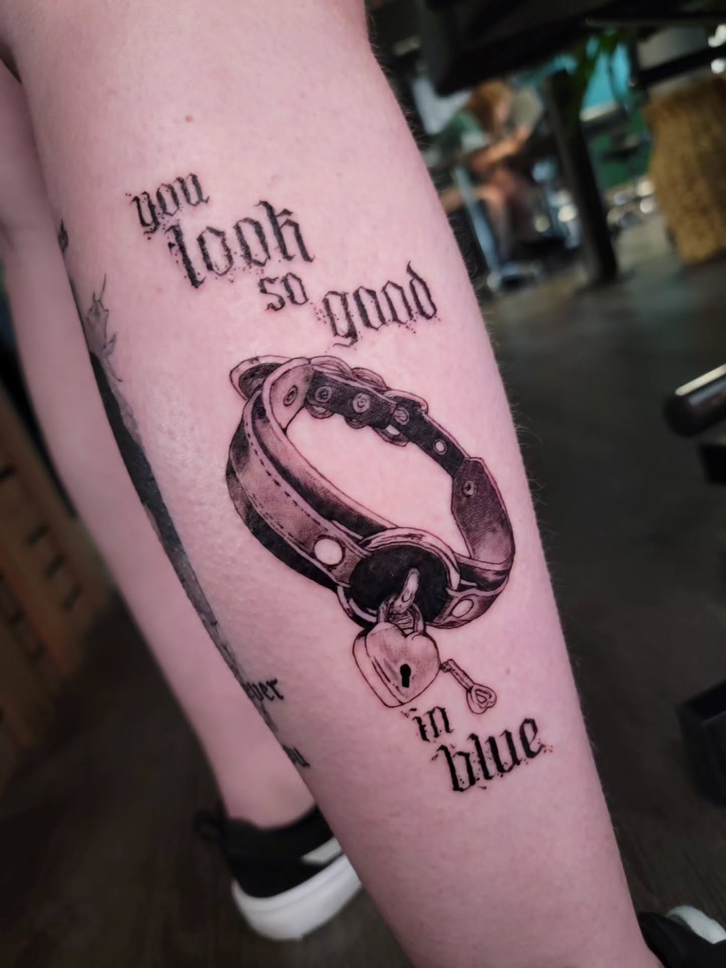 Choker and key black and grey tattoo on the forearm by Nathan Harkins-Oberbeck
