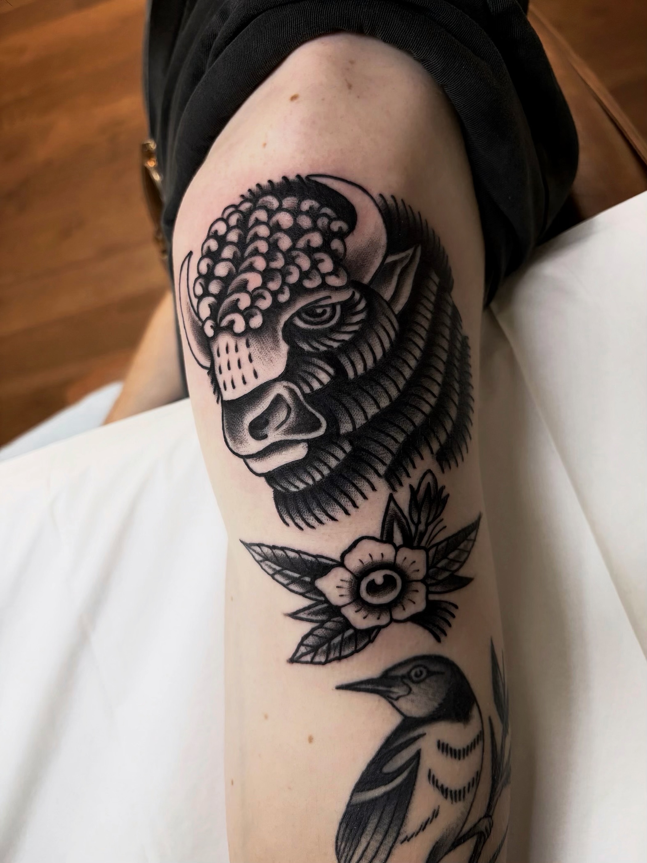 Bull, flower, bird American traditional tattoo on the forearm by Trav, Bayville, New Jersey