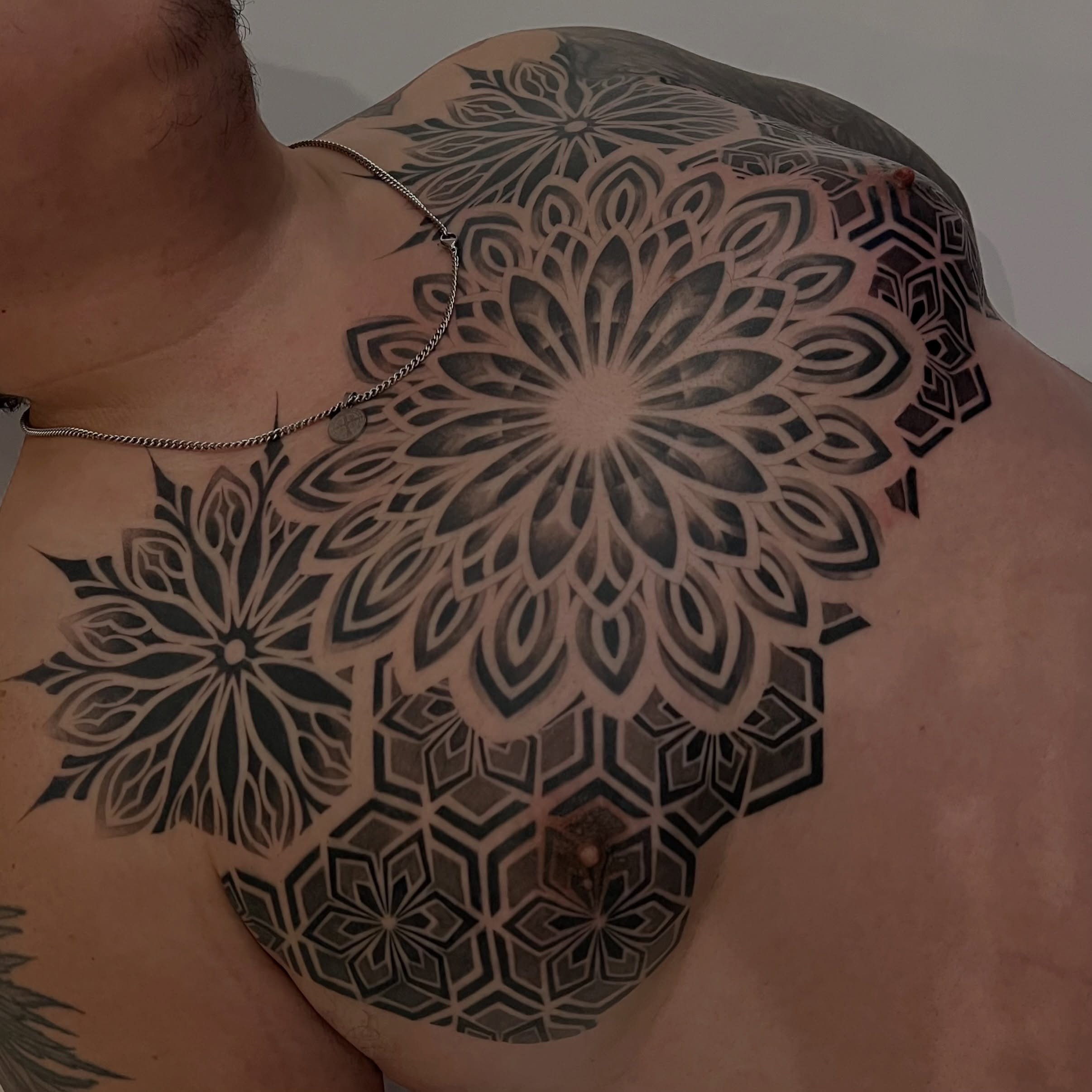 Geometric mandala geometric tattoo on the chest by Espi