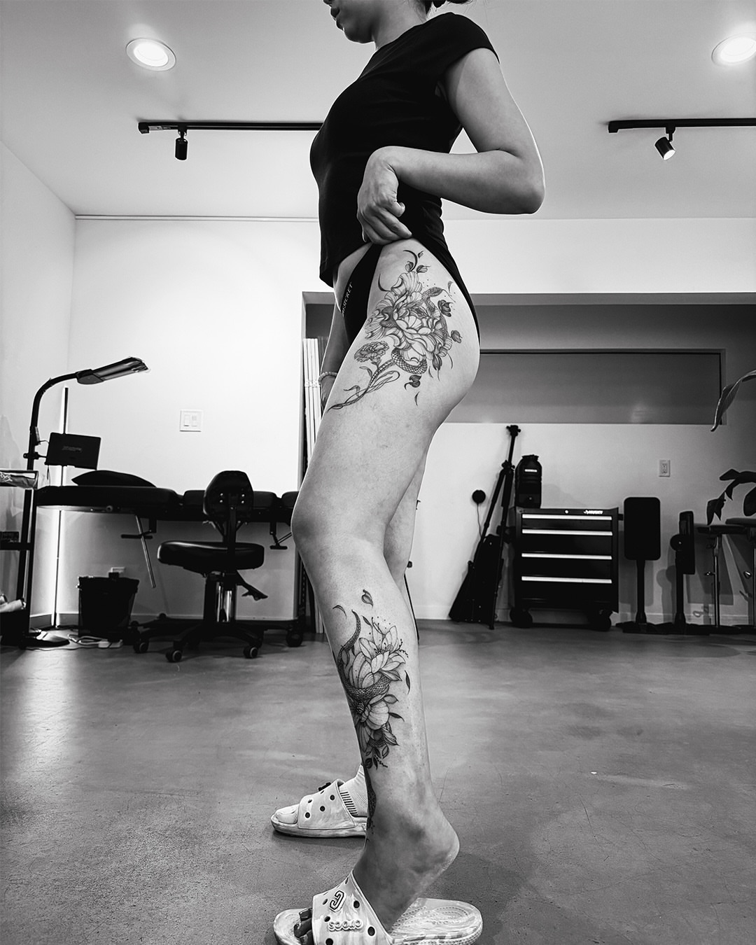Floral black and grey tattoo on the thigh by Esther ✣ Fine Line Floral Tattoo Artist LA, Los Angeles, California