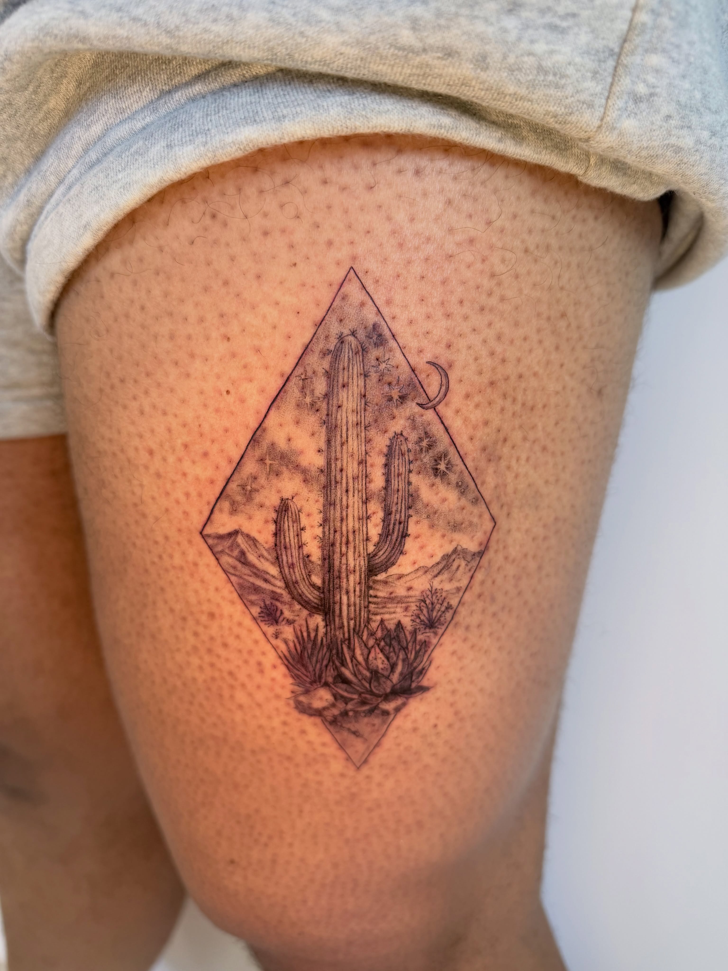 Desert landscape geometric tattoo on the thigh by Yuri Chloe Ngo Tattoo Artist