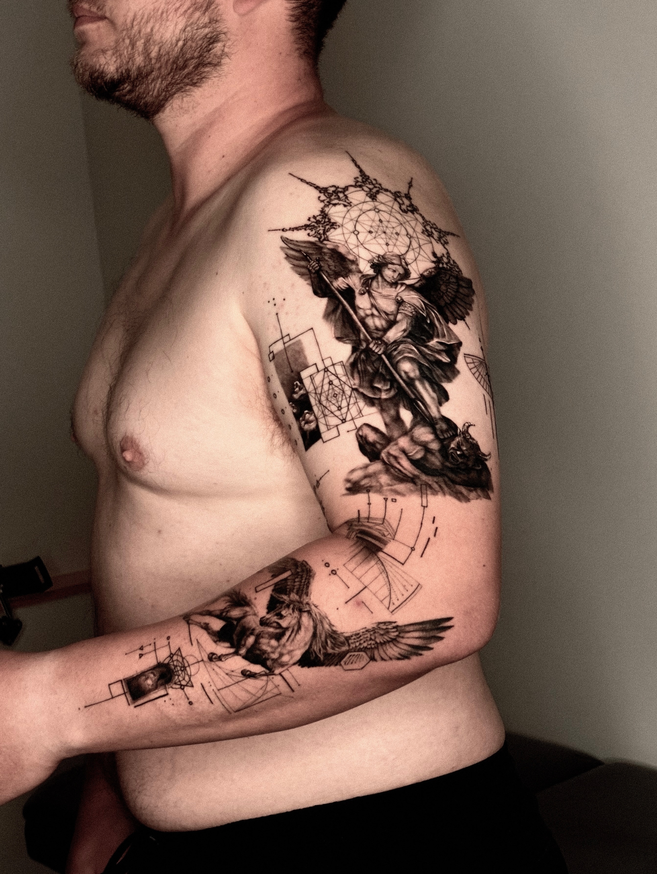 Angel with sword geometric tattoo on the shoulder by Seraph Geometry