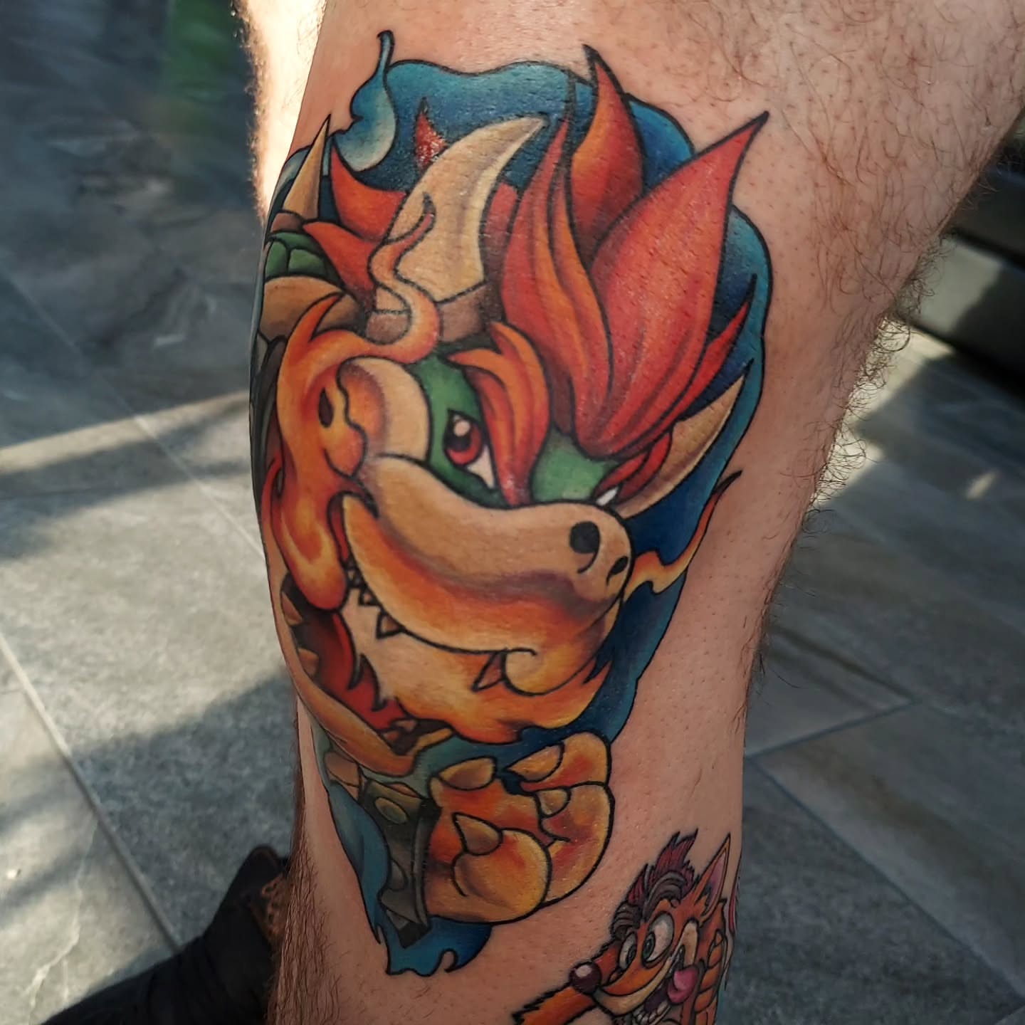 Bowser new school tattoo on the forearm by Kari Rhoades, Marion, Iowa