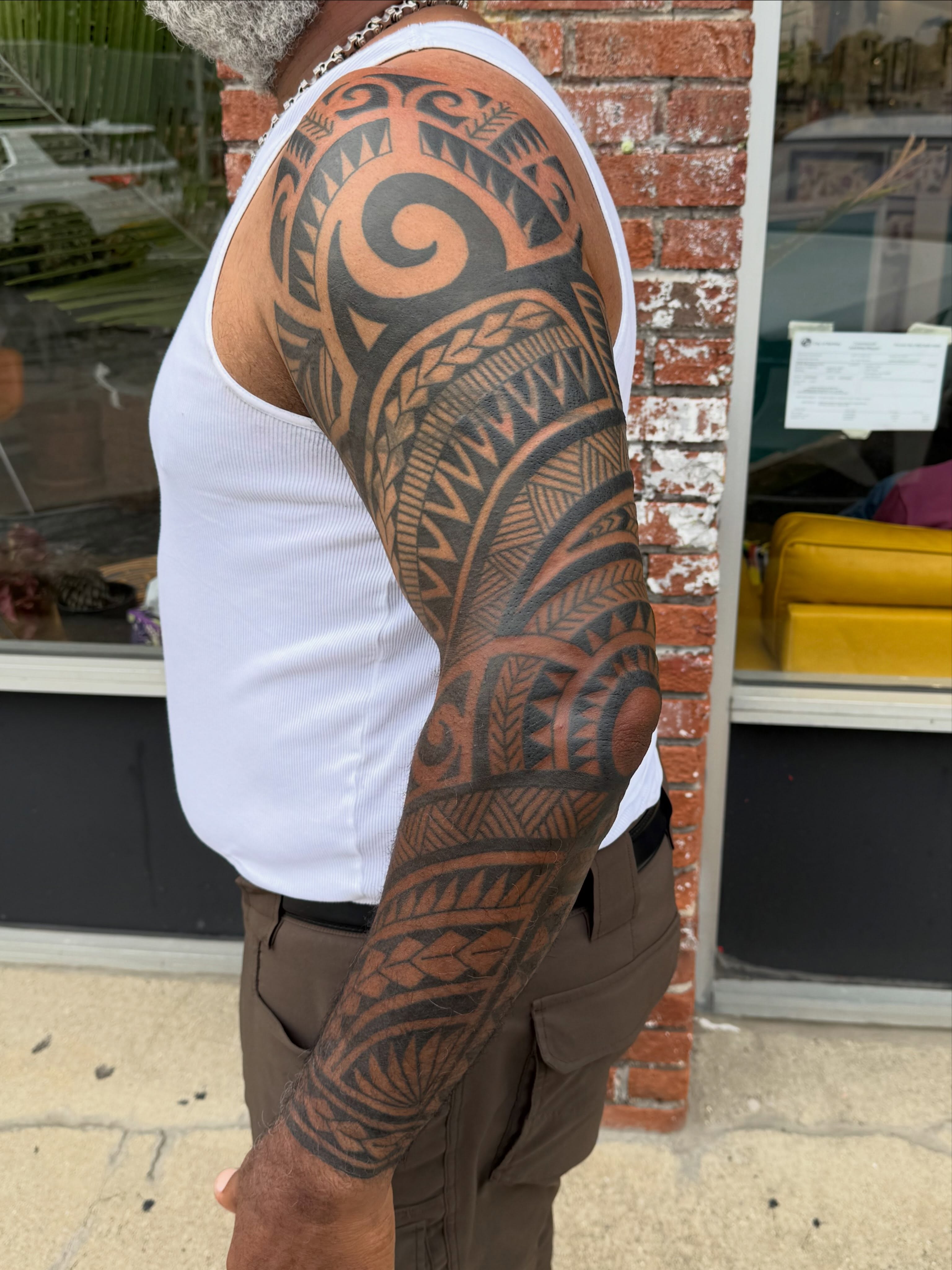 Tribal pattern tribal tattoo on the upper arm by Matt Paw