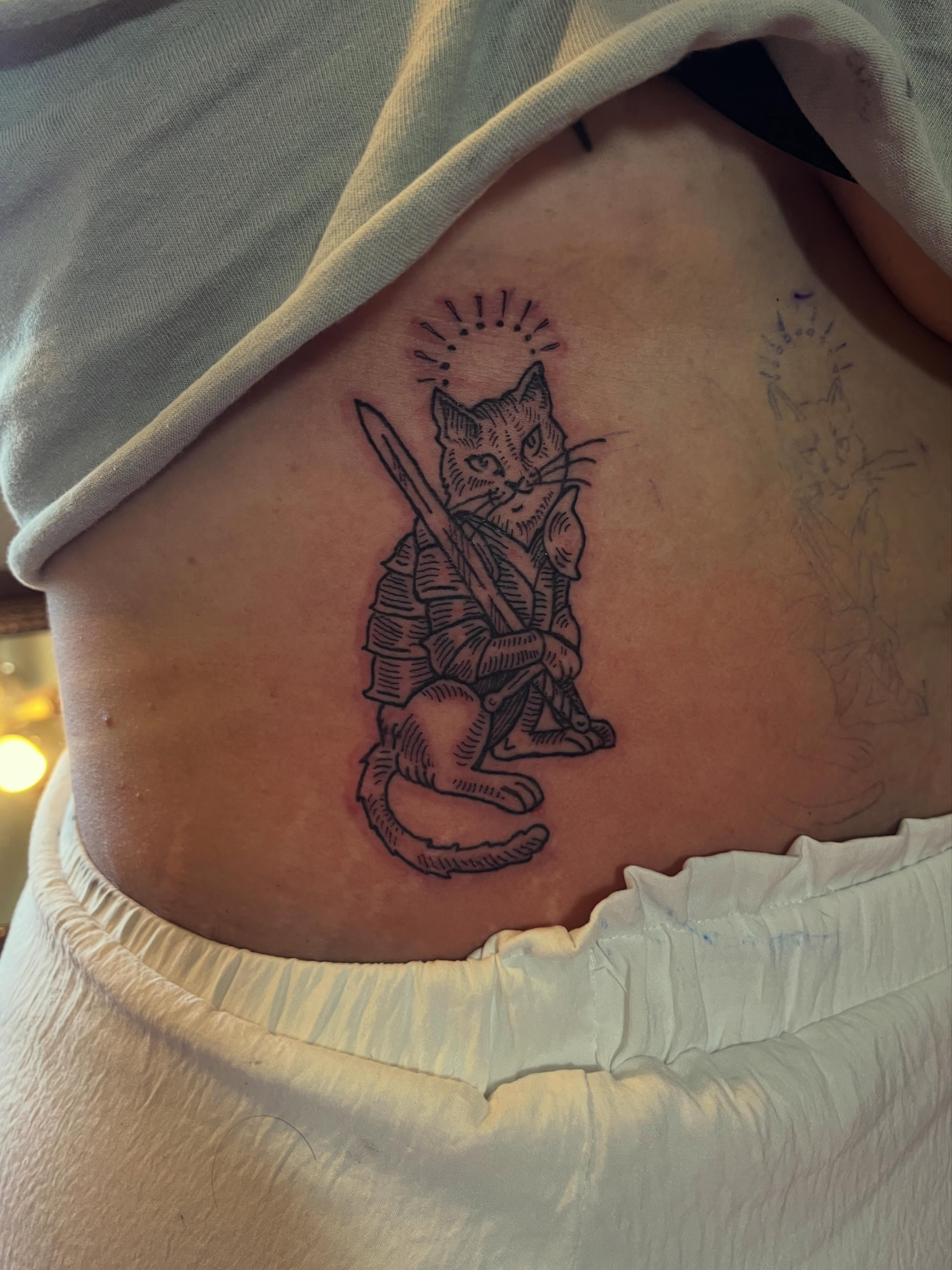Cat samurai black and grey tattoo on the ribs by Rafaela Lopez