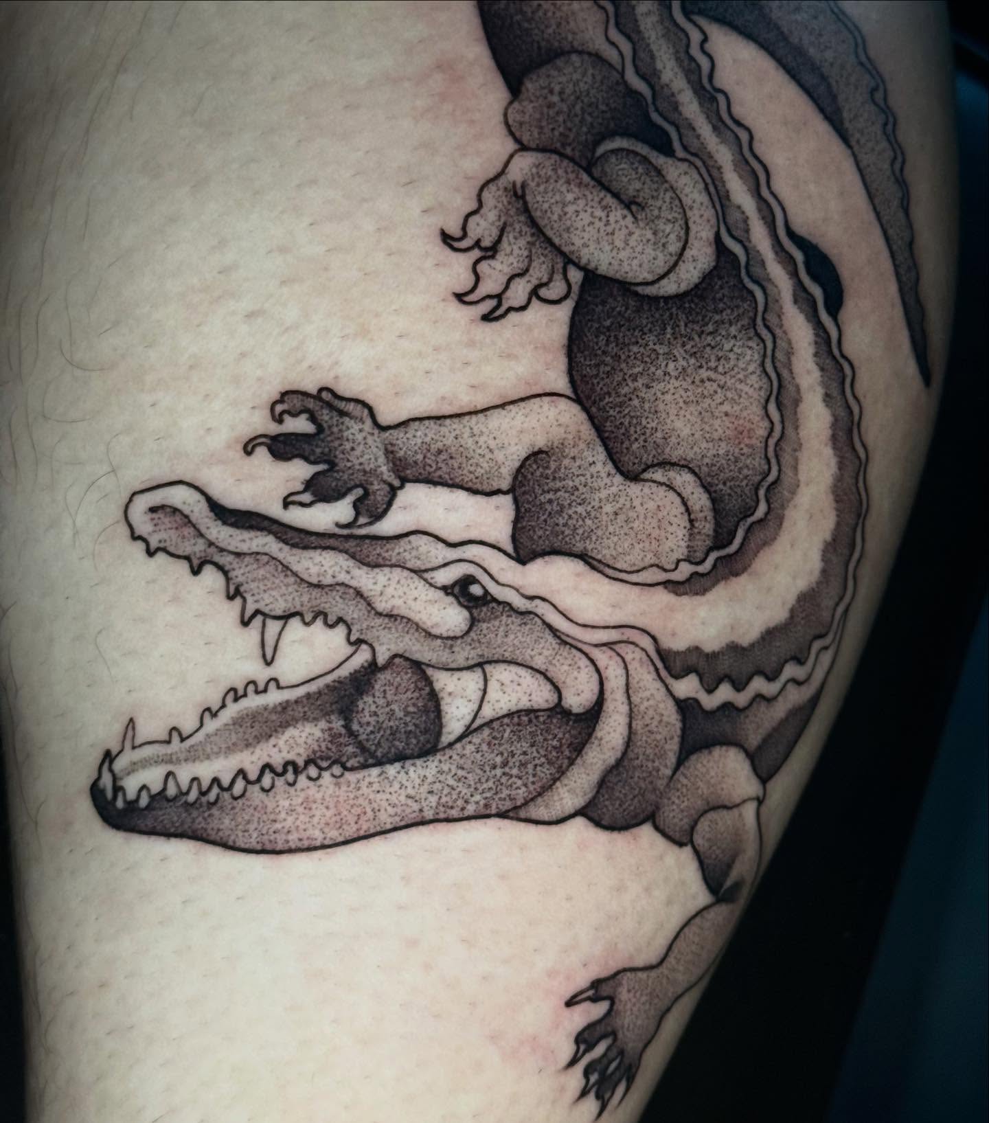 Alligator dotwork tattoo on the thigh by Mads Ink