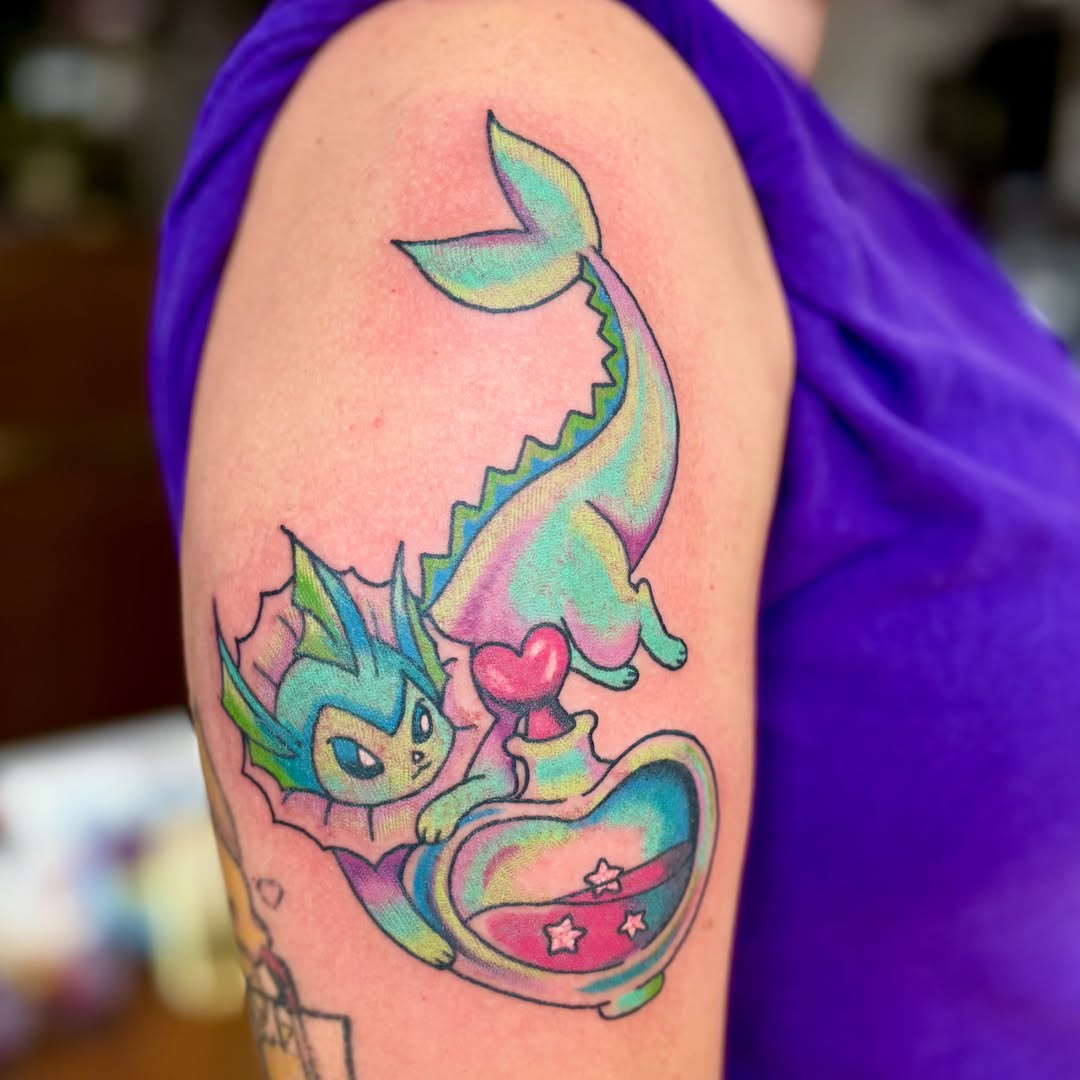 Mermaid new school tattoo on the upper arm by Taylor  Thompson