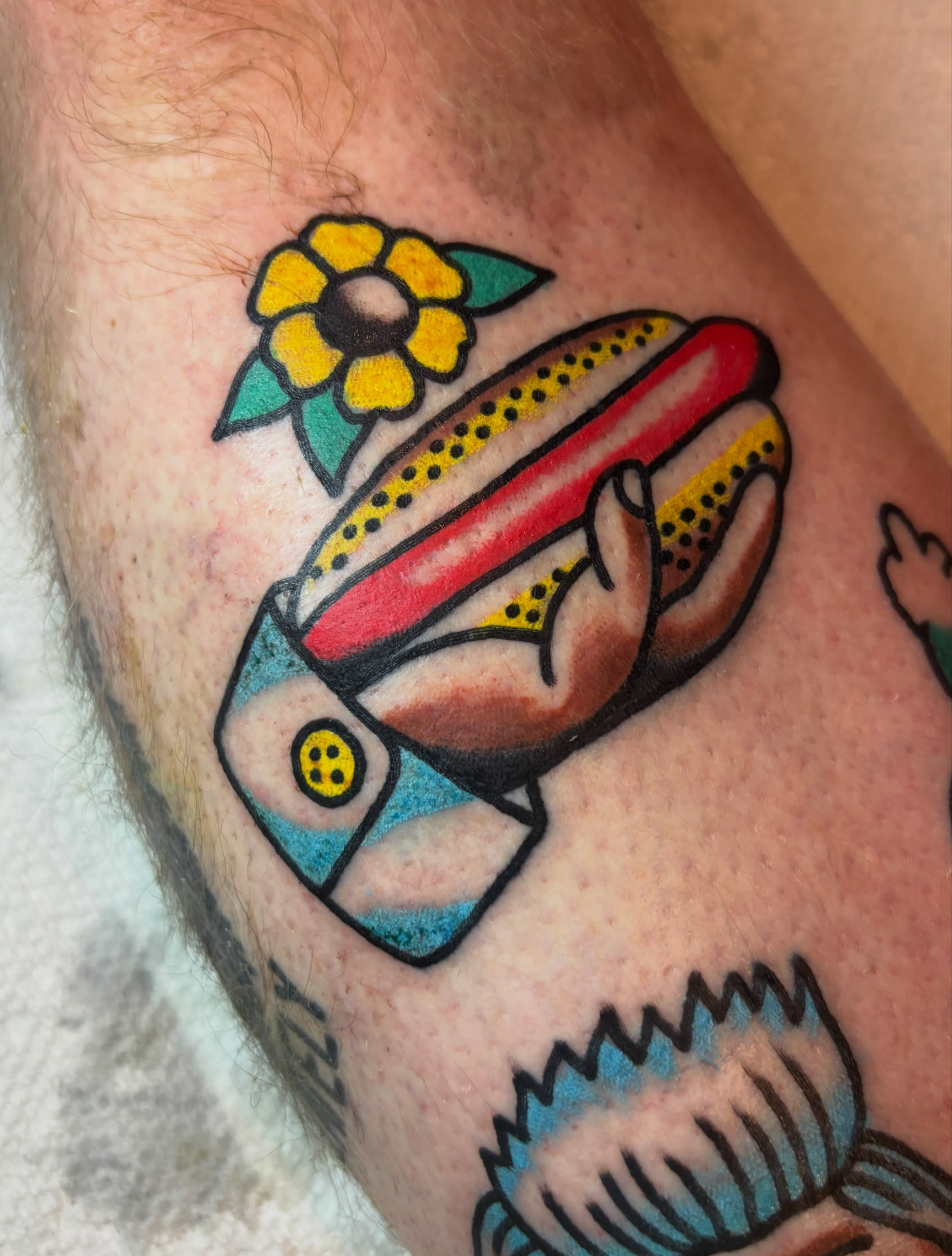 Hot dog American traditional tattoo on the forearm by Mitch Ashpaugh
