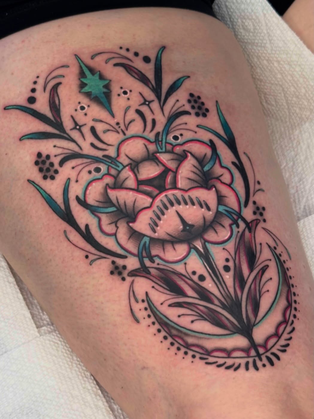Floral bouquet American traditional tattoo on the thigh by Tattoos by Angel Lee