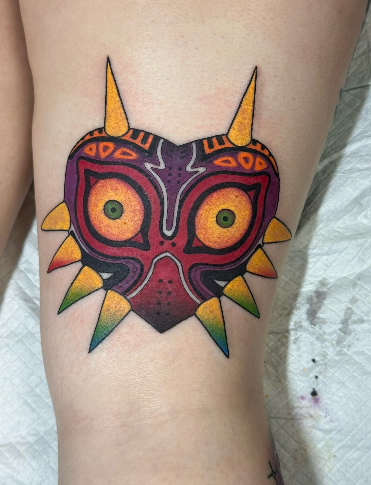 Majora's Mask geometric tattoo on the thigh by Tattoo artist