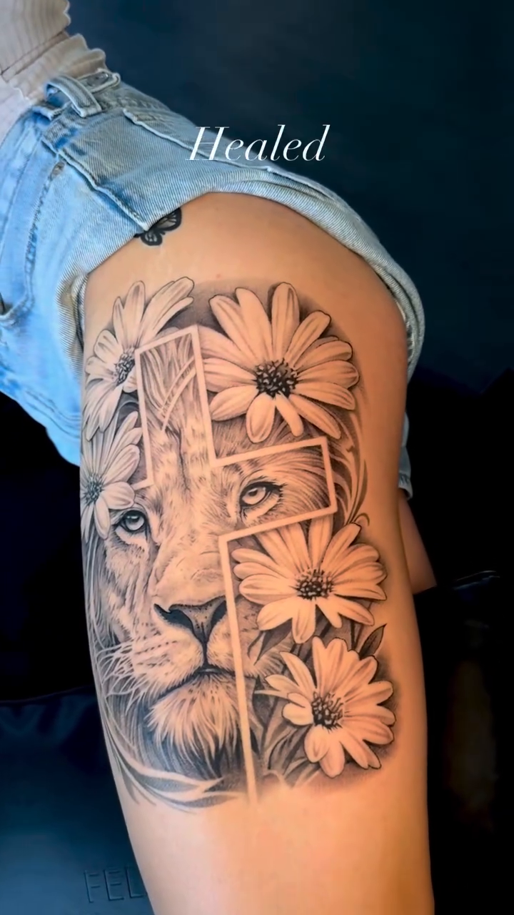 Lion and flowers realism tattoo by Elijah Forster - Nashville Tattoo Artist