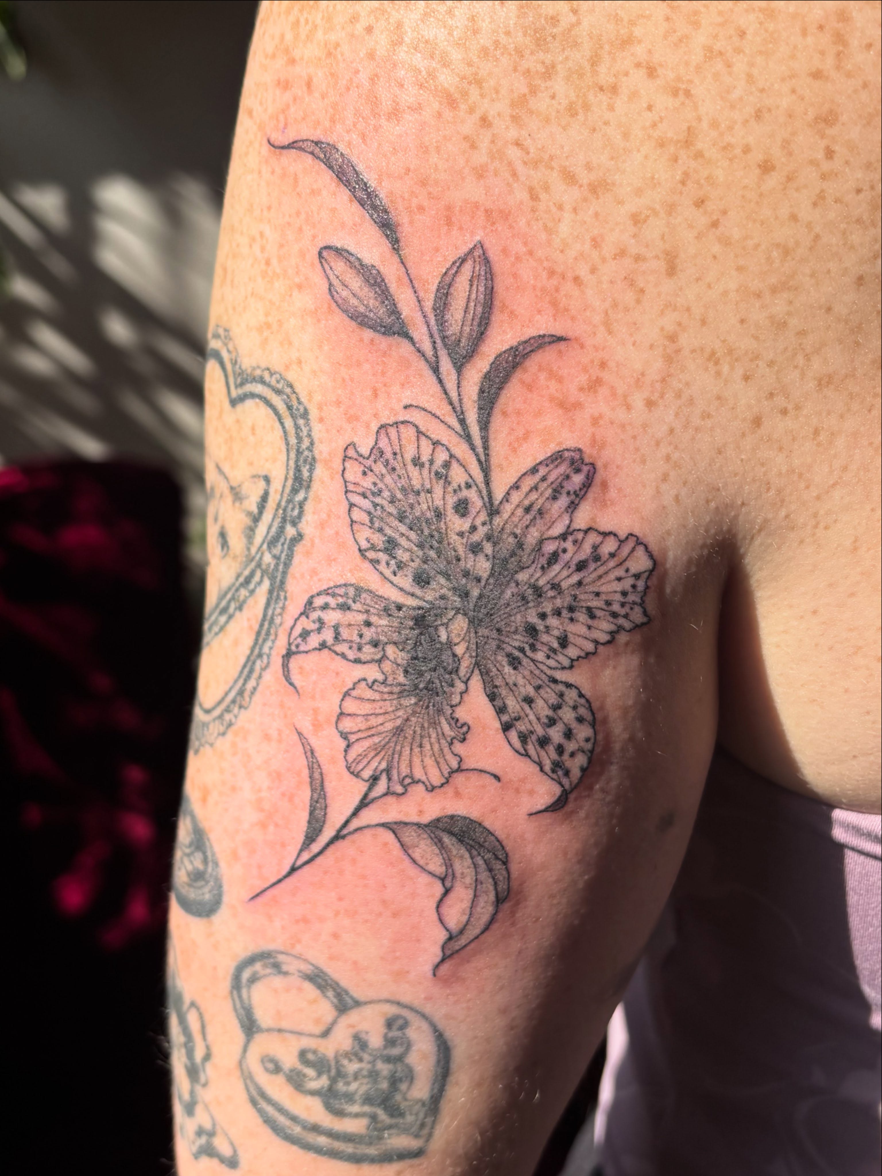 Lily black and grey tattoo on the forearm by Anna Kathleen, Des Moines, Iowa