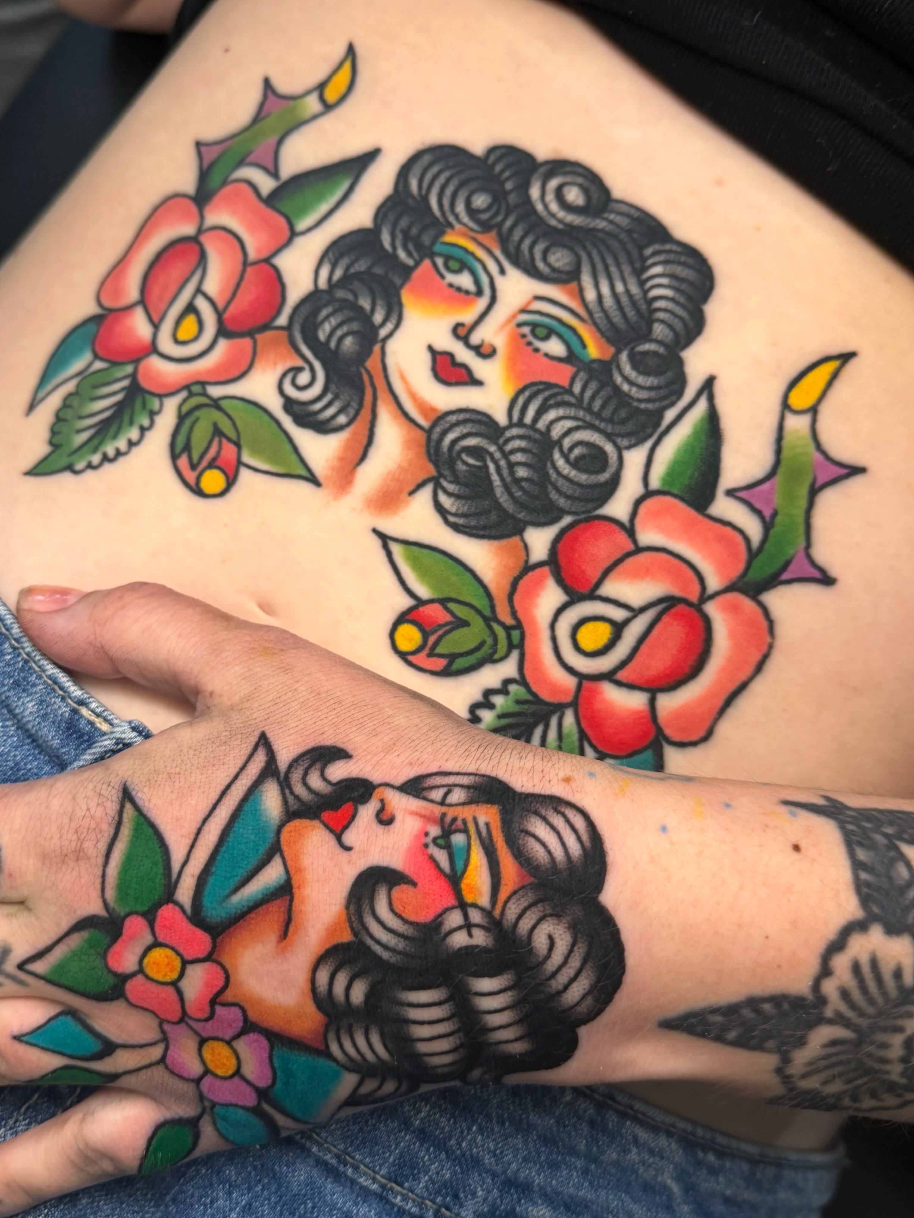 Woman with roses American traditional tattoo on the thigh by ⭐️ Erin Bauer ⭐️