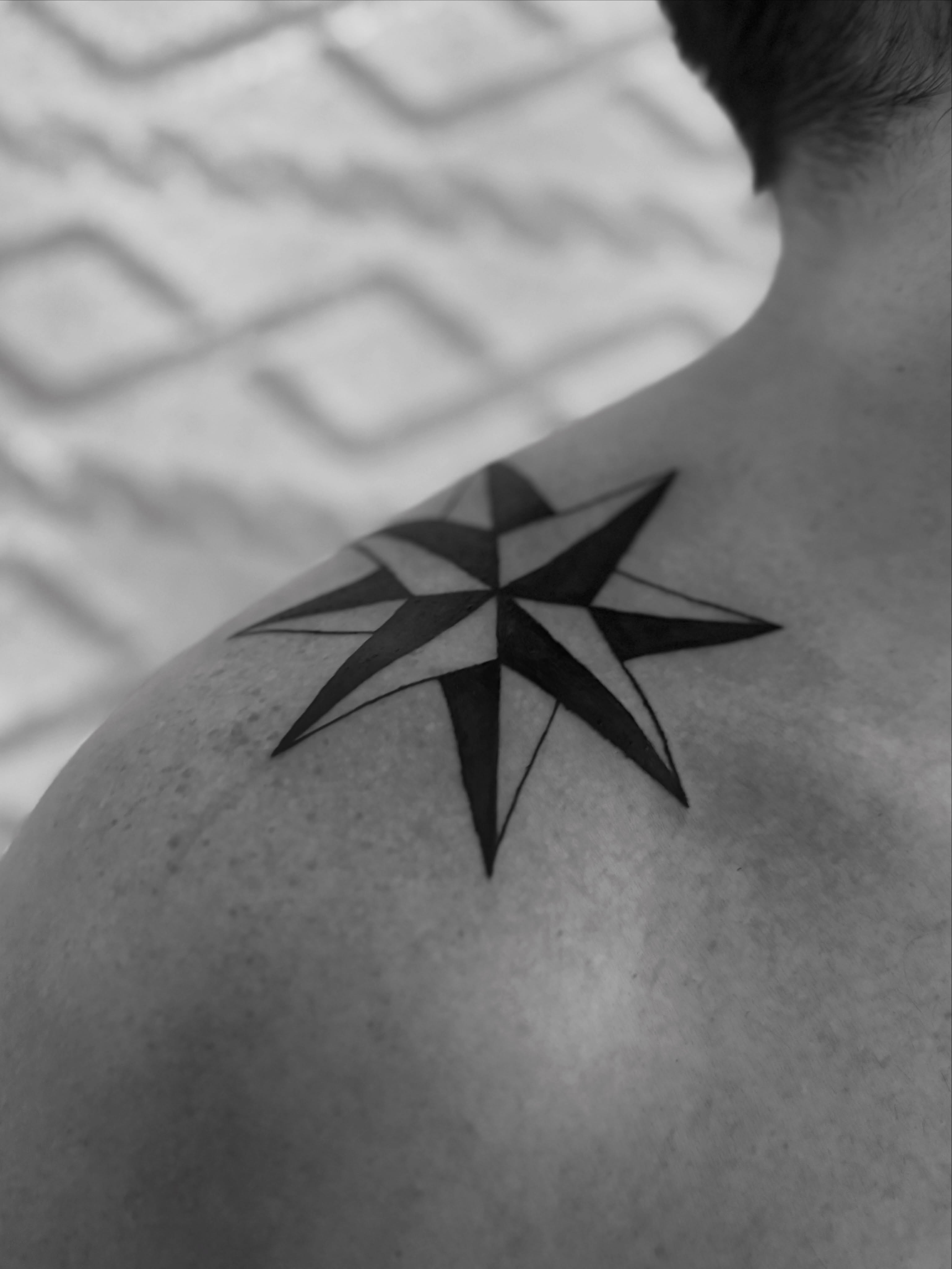 Nautical star geometric tattoo on the shoulder by @secretlinetattoo