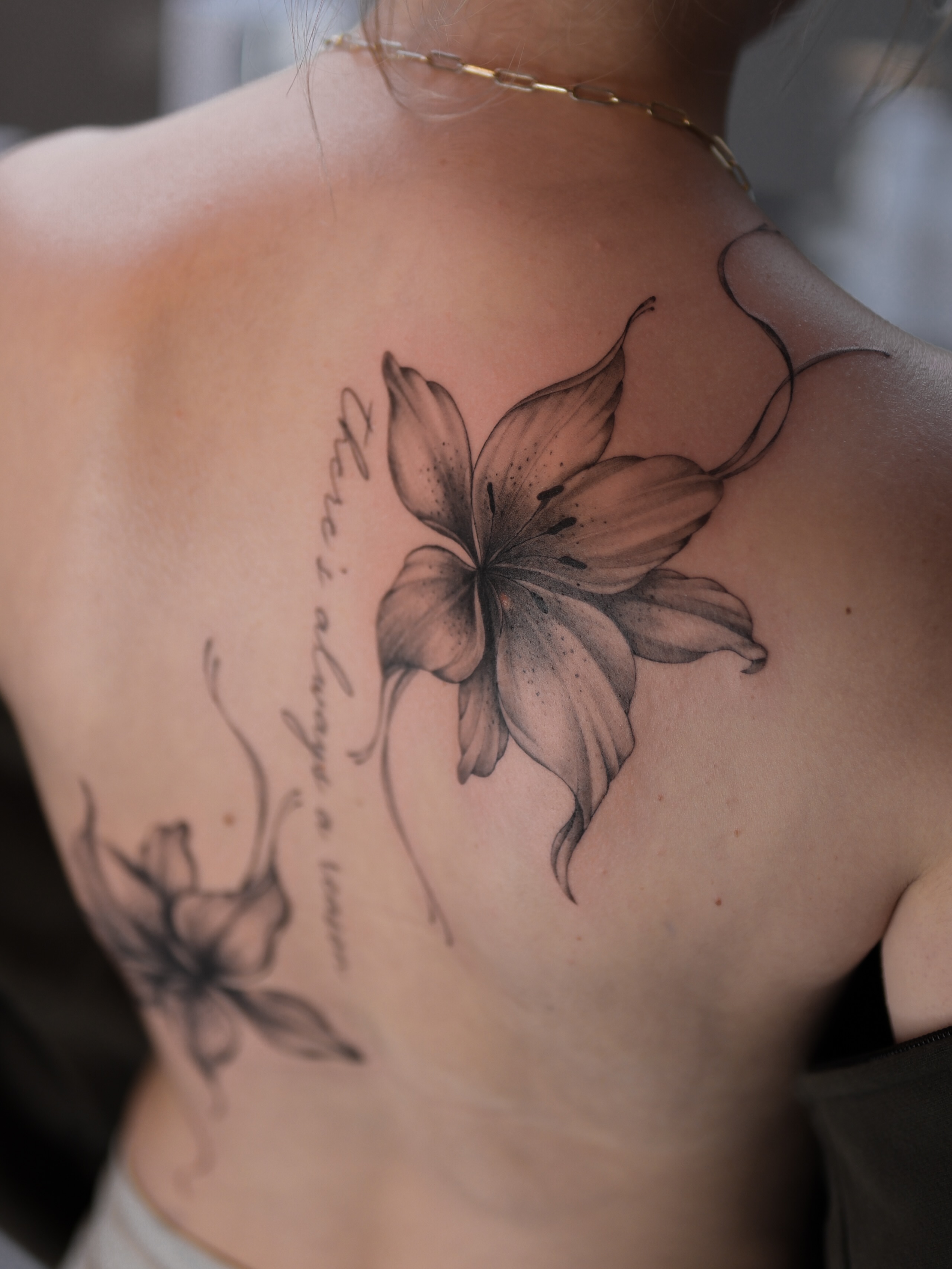 Lily realism tattoo on the shoulder by Alina 🌙 Tattoo in Calgary 🇨🇦