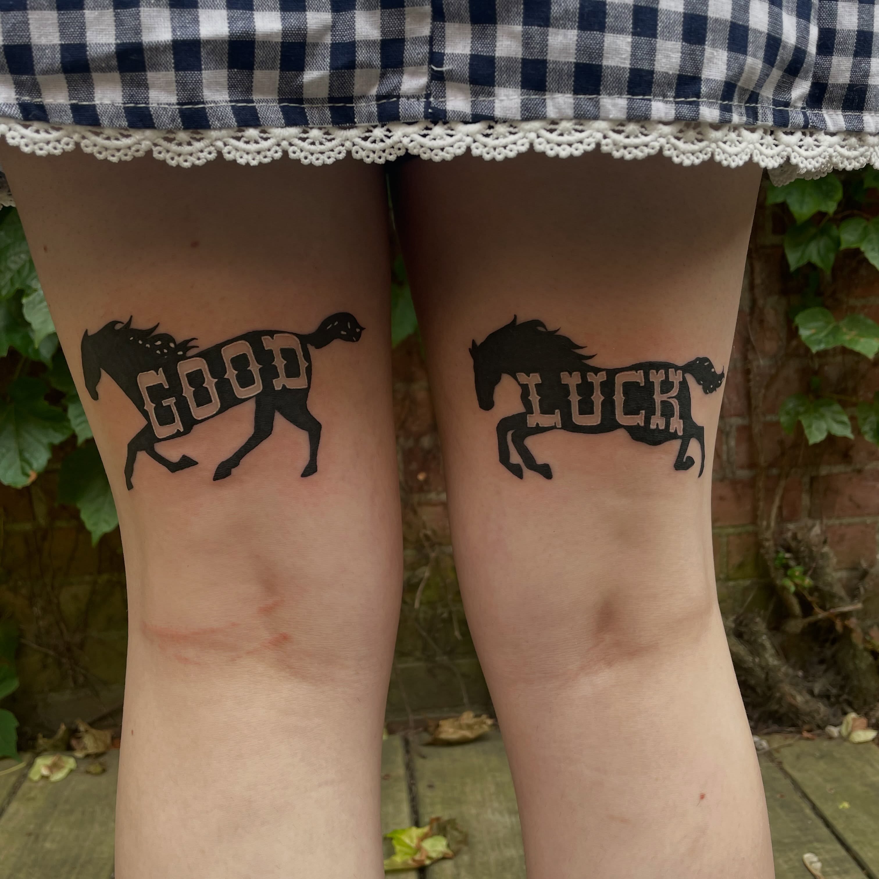 Good luck black and grey tattoo on the thigh by Avalon Sable