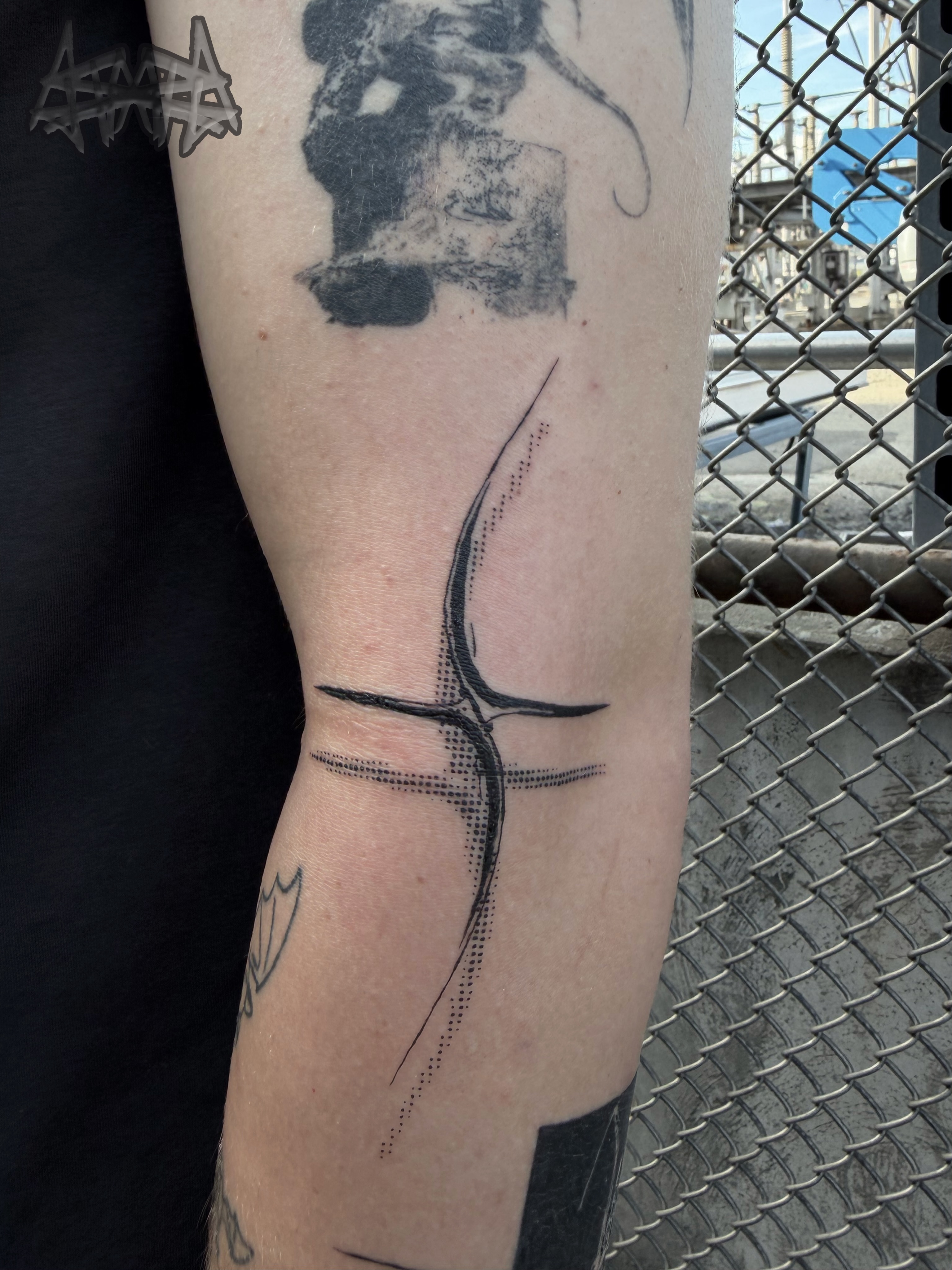 Abstract cross dotwork tattoo on the forearm by Haza