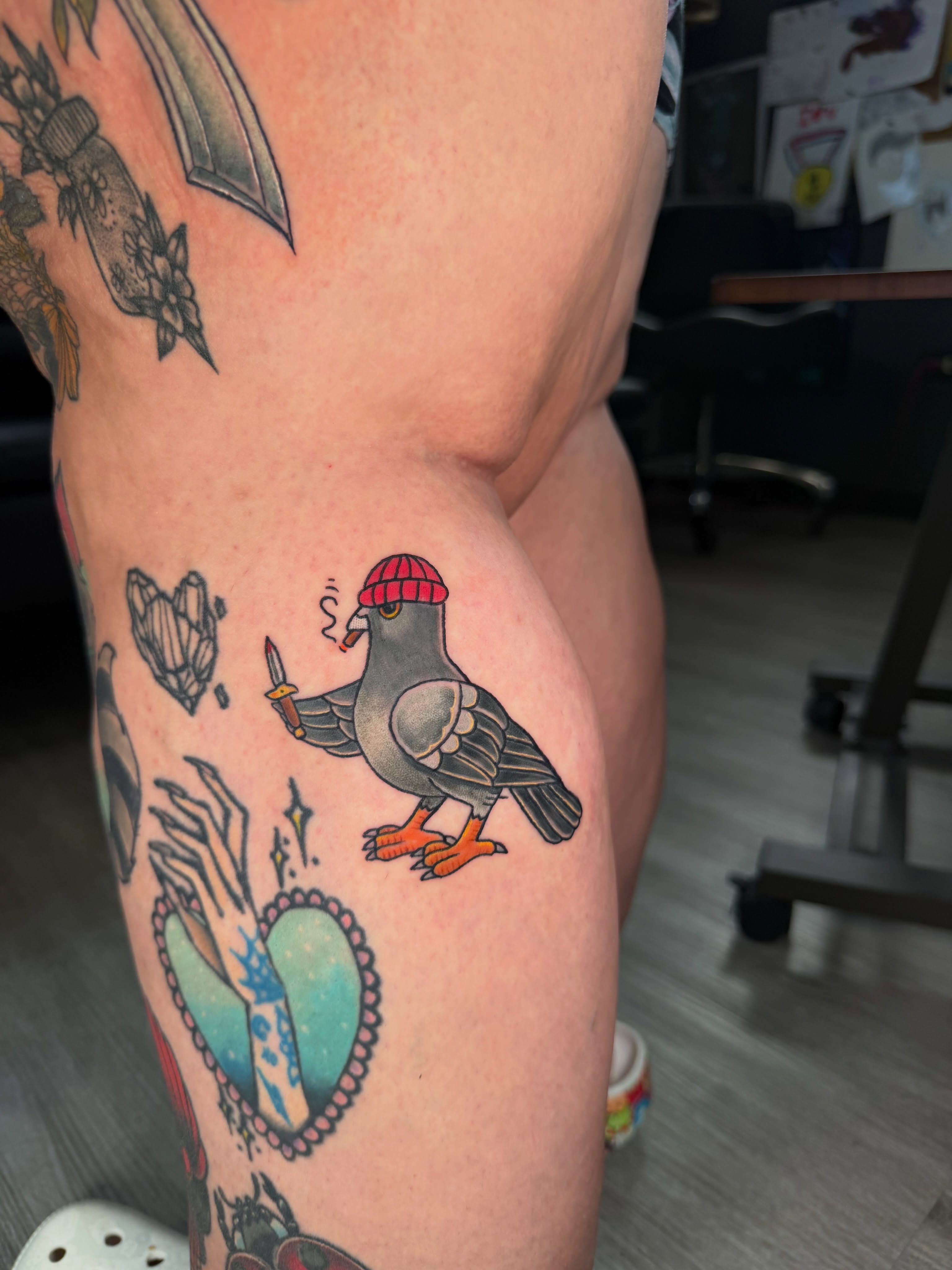 Pigeon wearing hat American traditional tattoo on the thigh by Beau Zeis