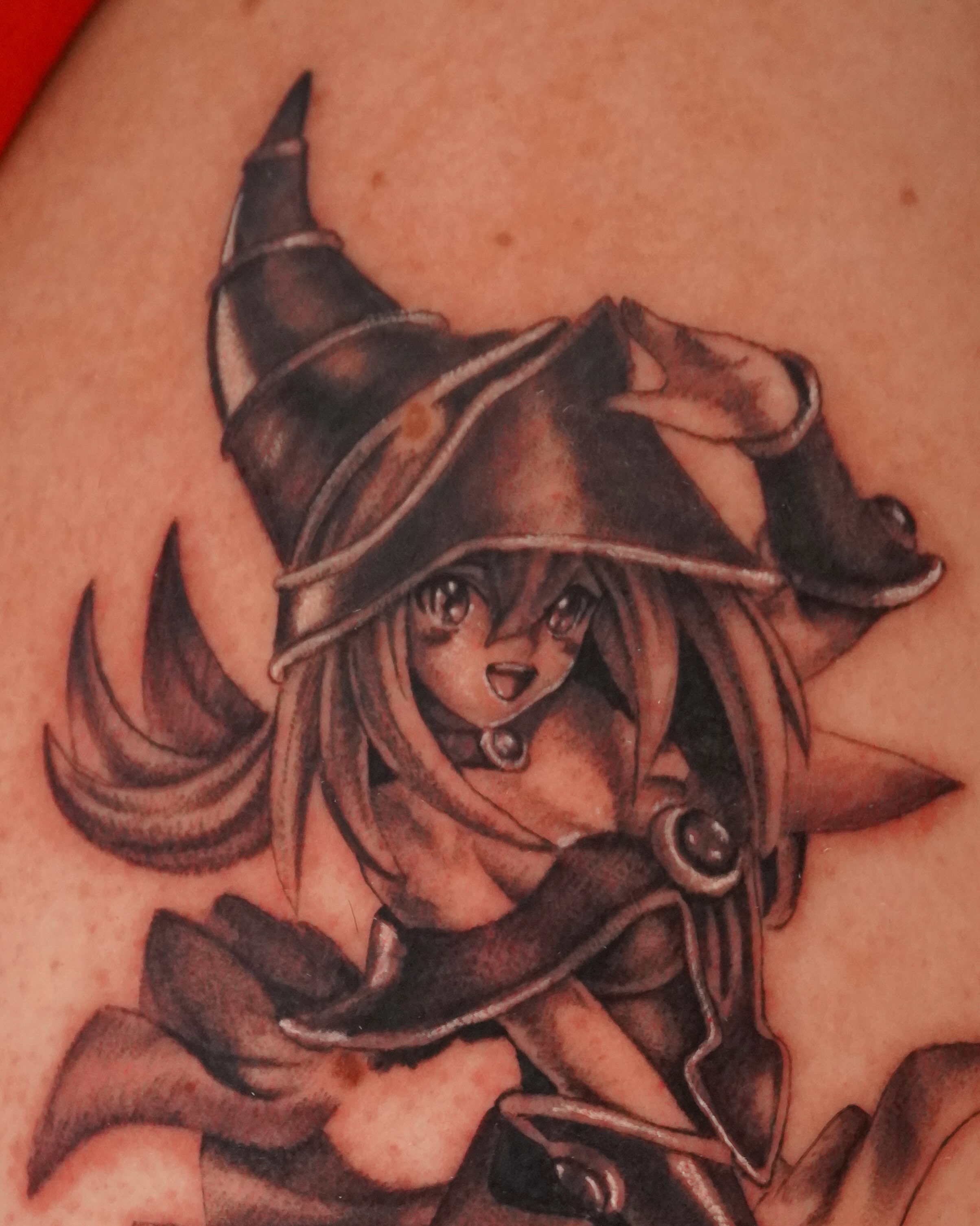 Anime witch anime tattoo on the upper arm by hallow ☣︎ tattoo artist, Philadelphia, Pennsylvania