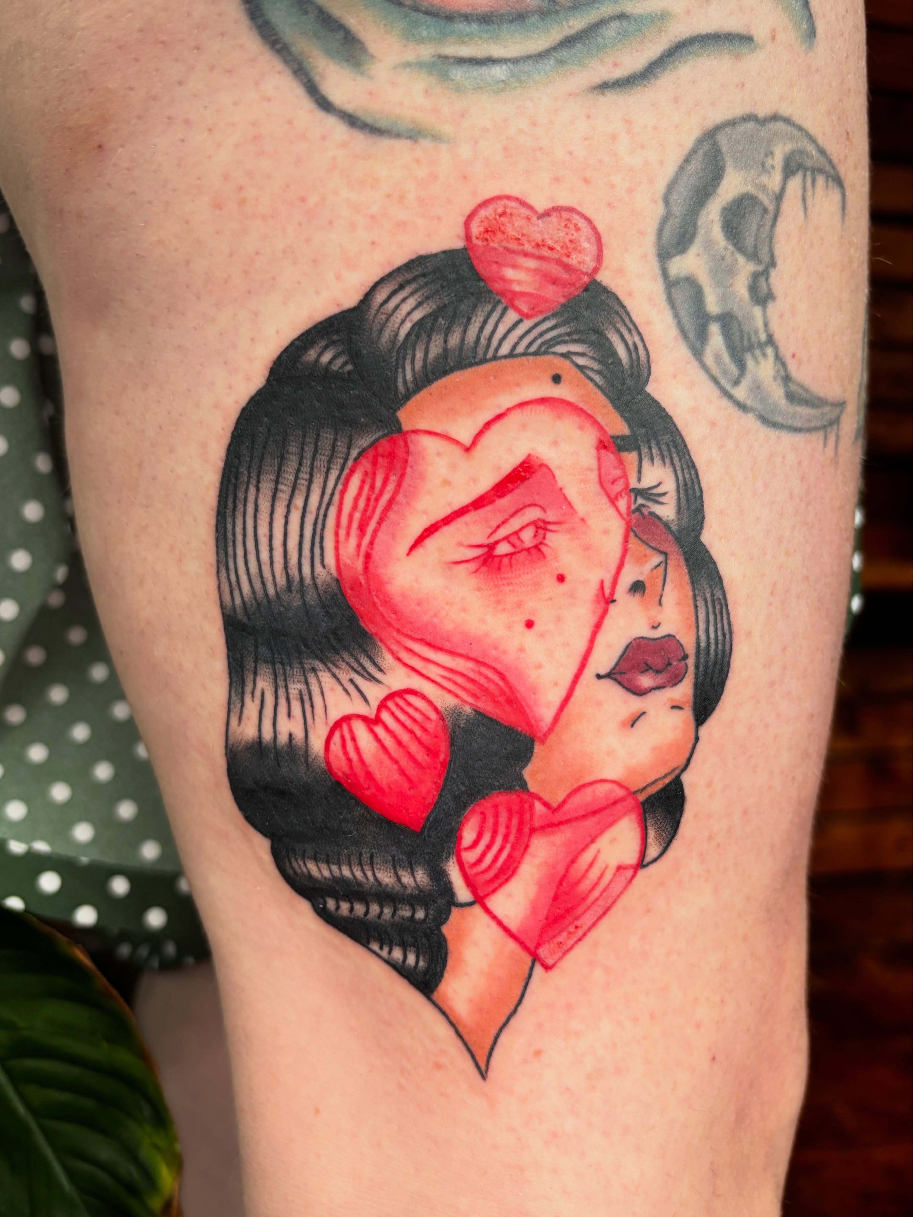 Woman with hearts American traditional tattoo on the thigh by Lilly Evans