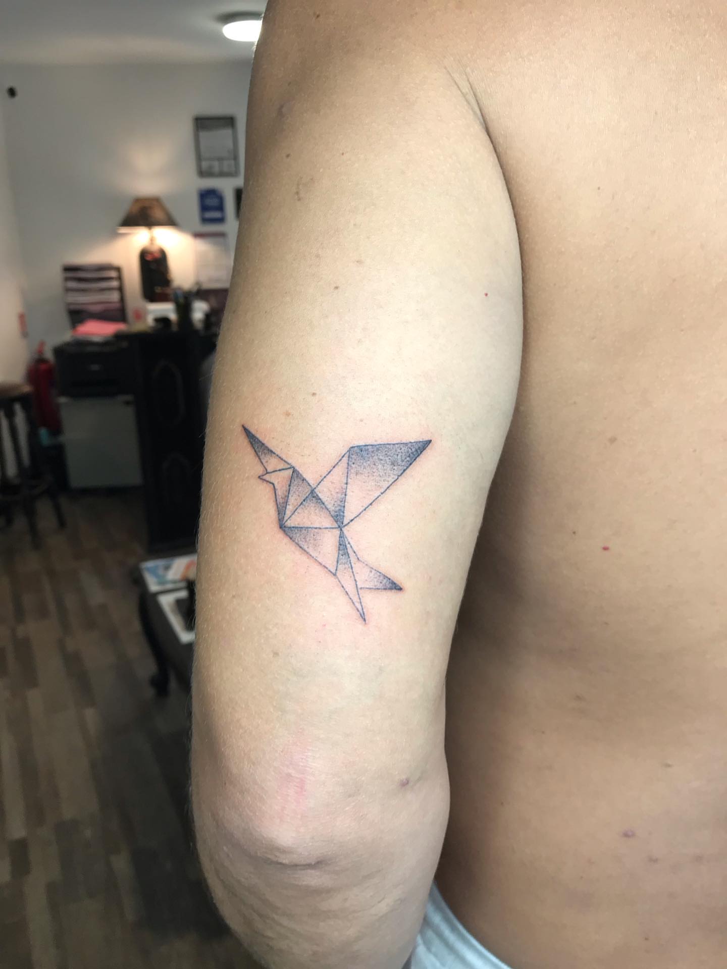 Origami bird dotwork tattoo on the forearm by Moss Quito Tattoo
