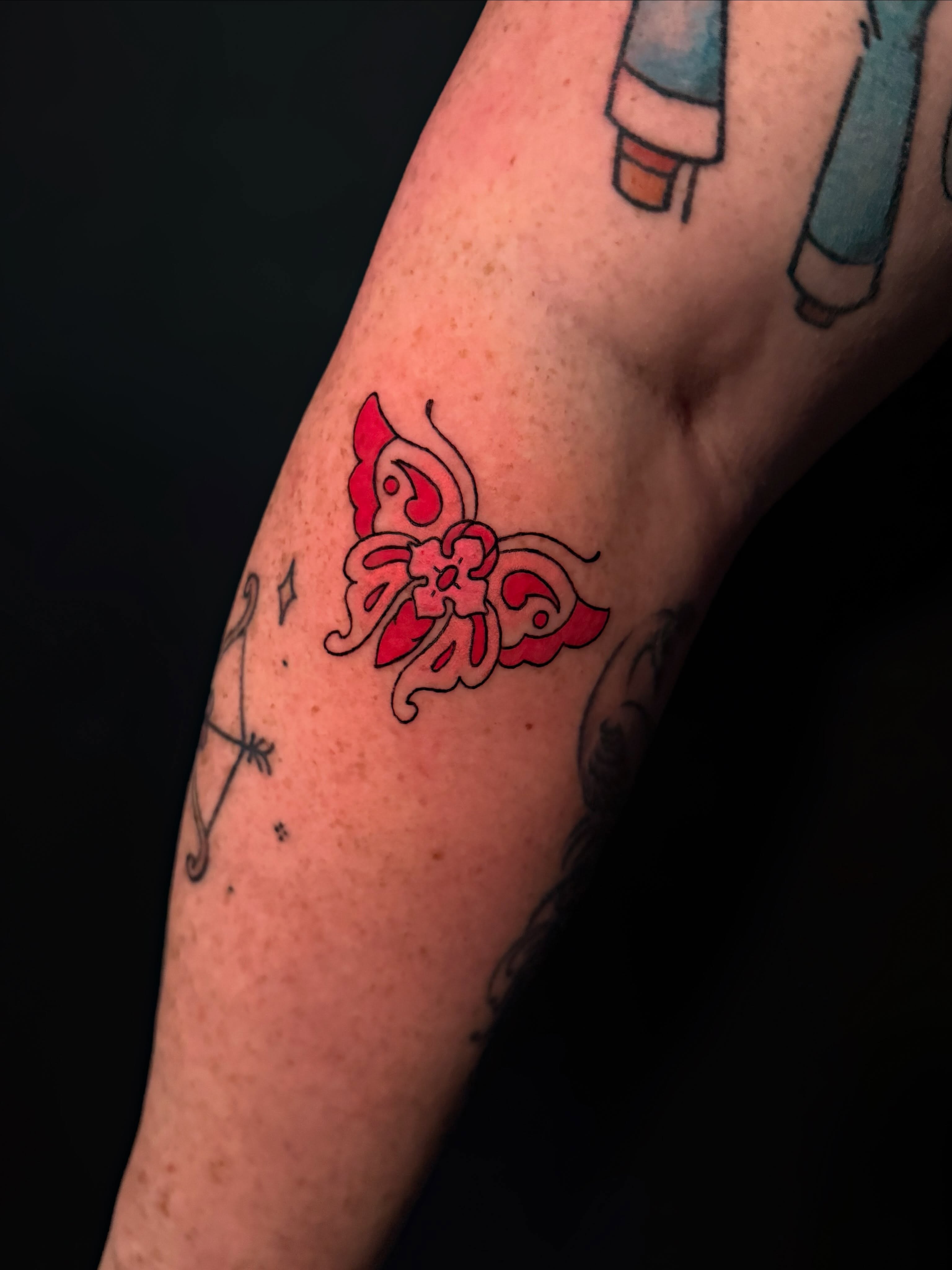 Butterfly American traditional tattoo on the forearm by Ivy-Jade Edwards, Memphis, Tennessee