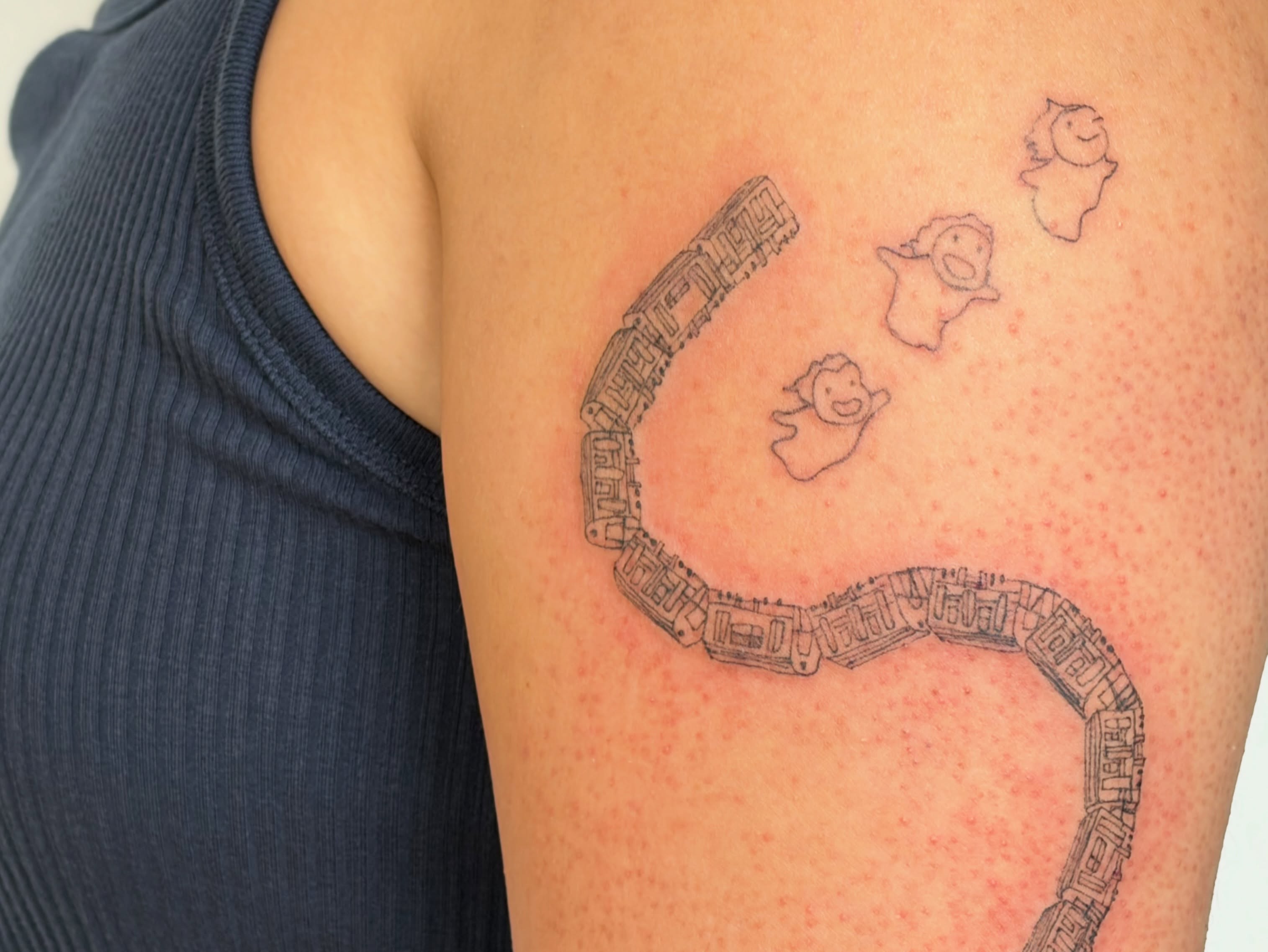 Train and ghosts black and grey tattoo on the shoulder by annie’s tattoos ⭐꩜ .ᐟ
