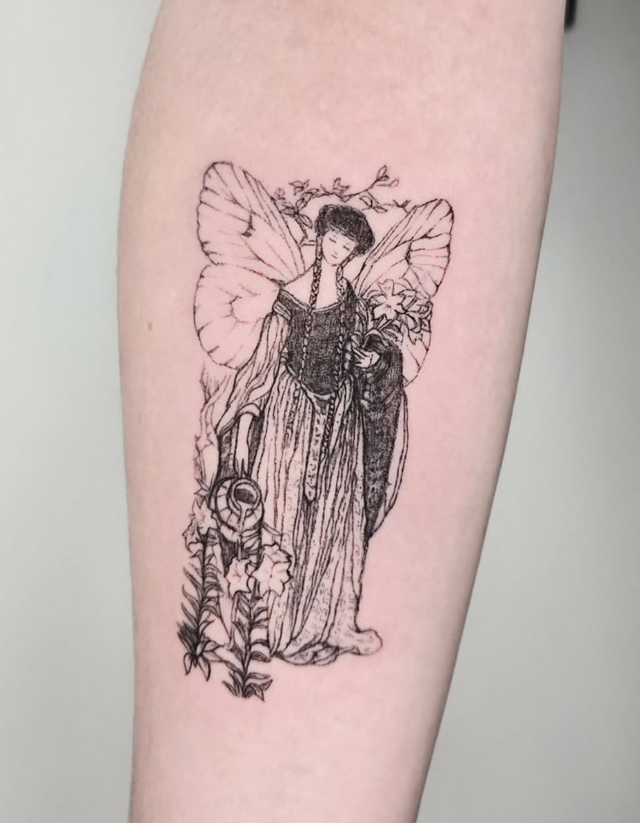 Fairy black and grey tattoo on the forearm by Vintage tattoo