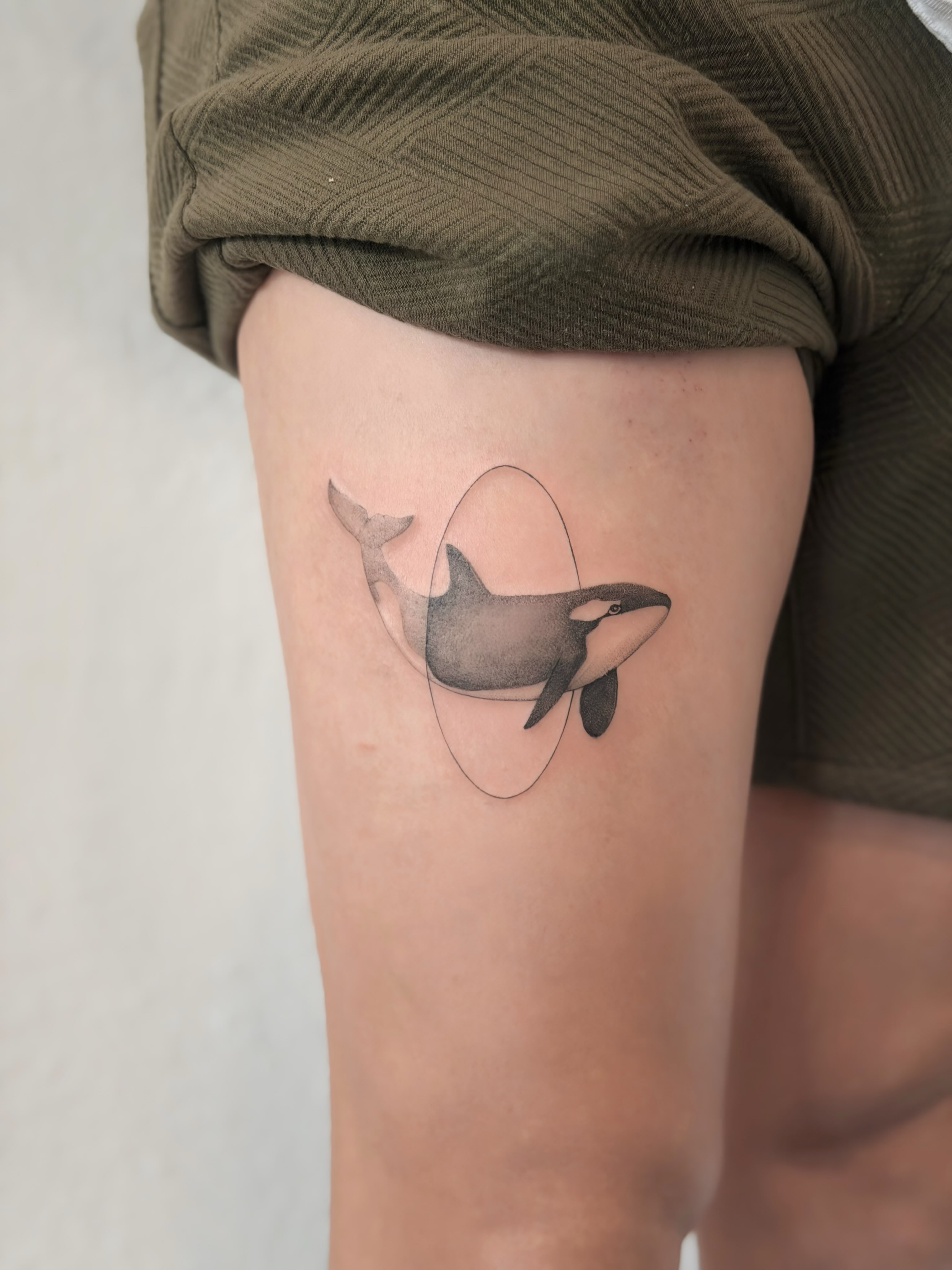 Orca whale black and grey tattoo on the thigh by Seattle tattoo artist-Mia