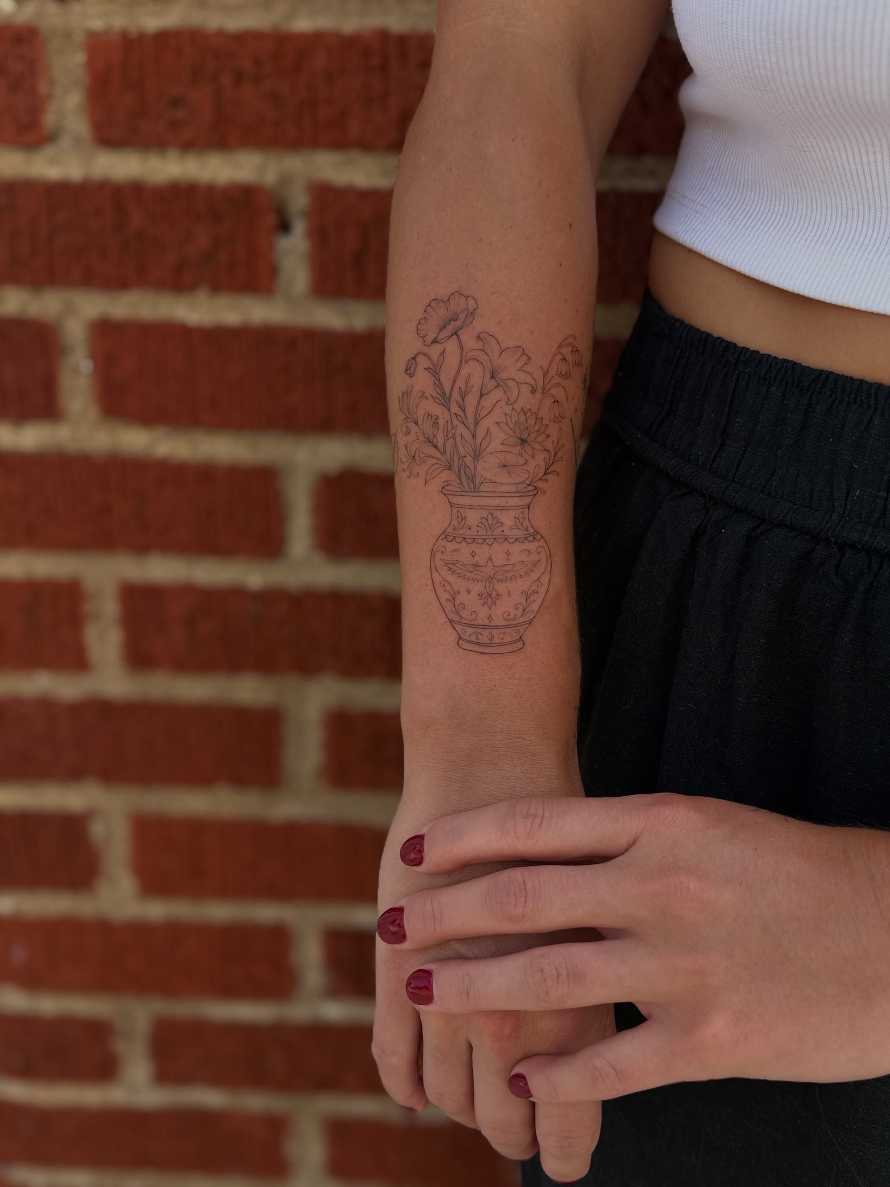Vase with flowers black and grey tattoo on the forearm by 𝙸𝚗𝚔𝚊𝚗𝚍𝚕𝚒𝚕𝚢𝚜 🤎💉🐻🌸