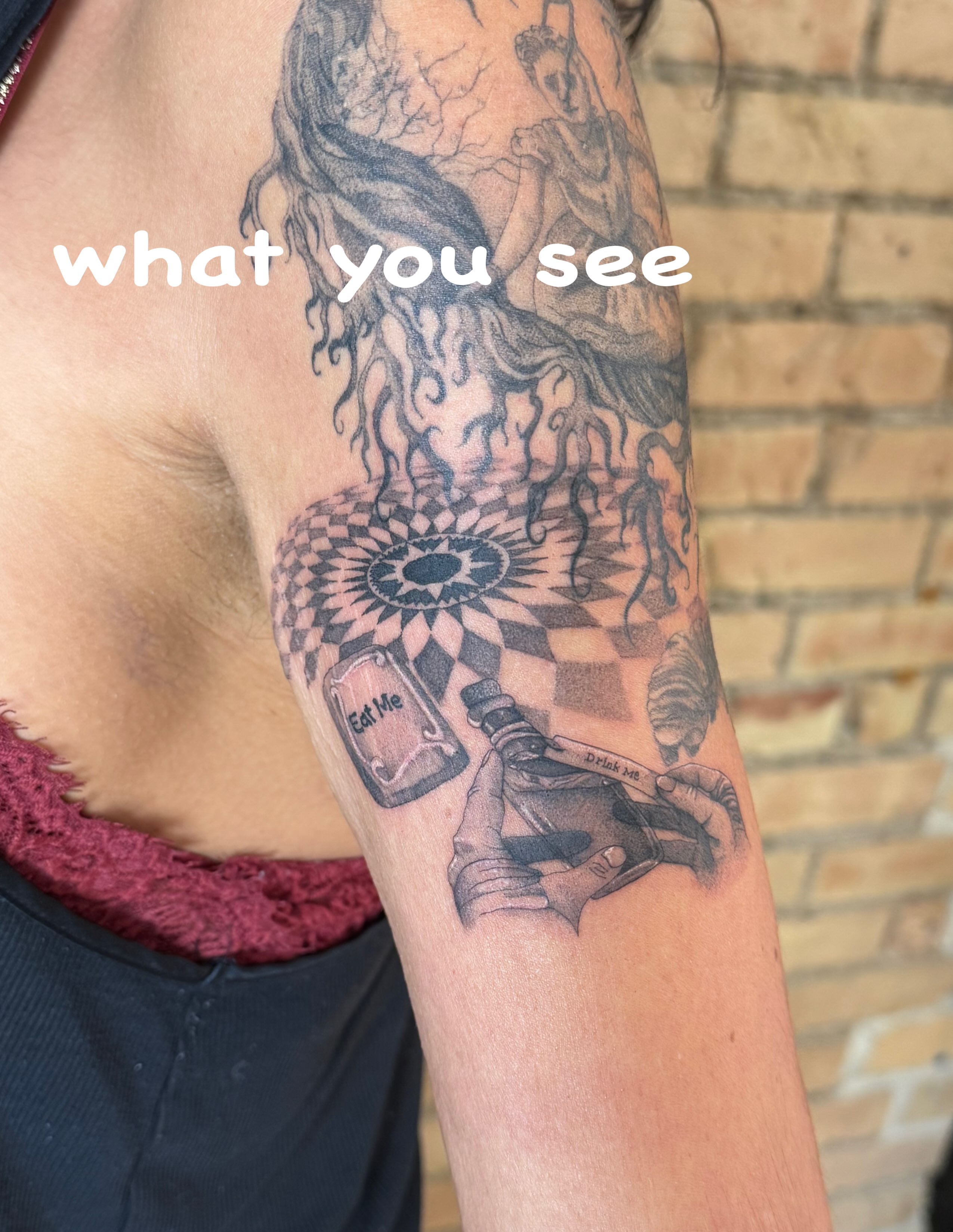 Alice in Wonderland surrealism tattoo on the forearm by Dre