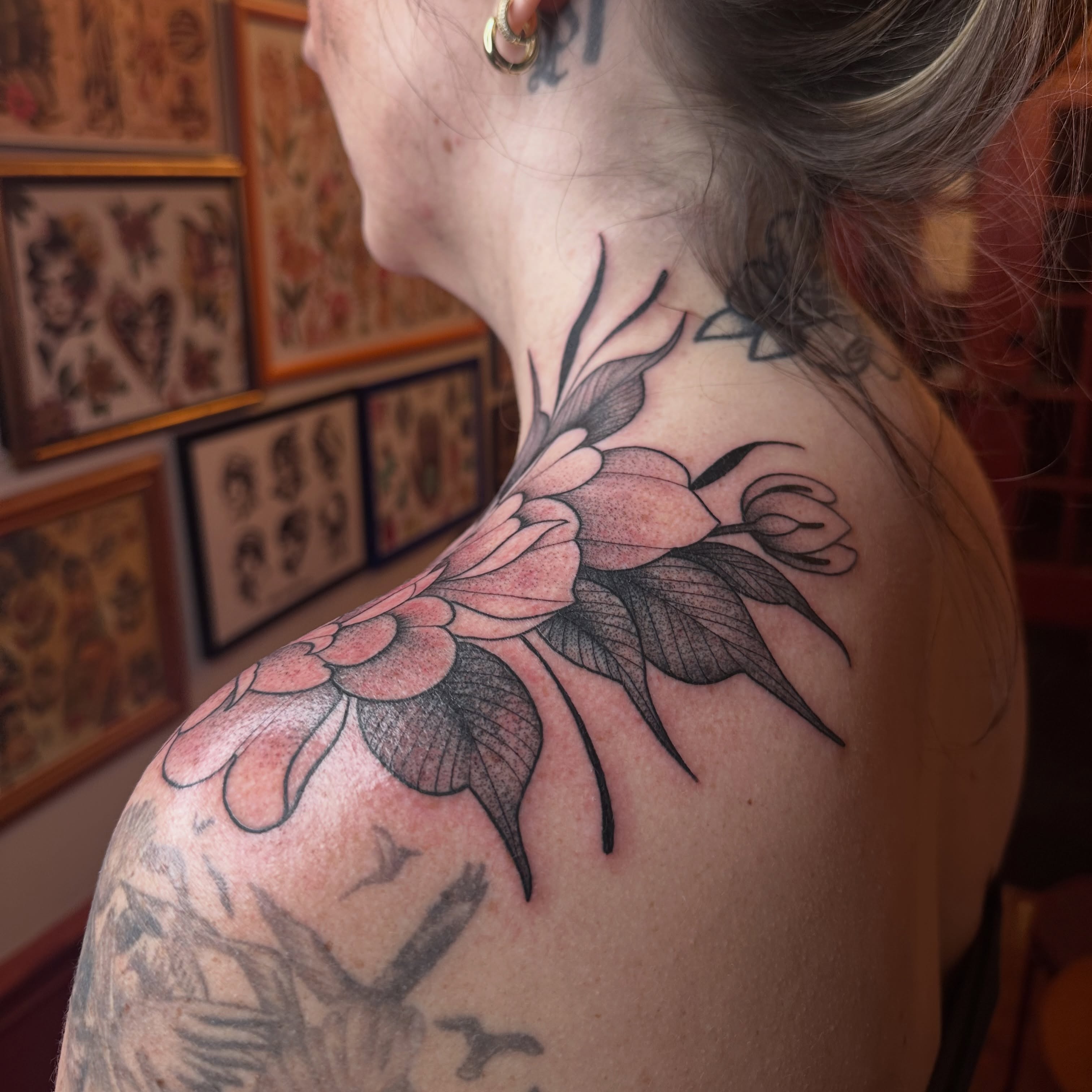 Floral arrangement black and grey tattoo on the shoulder by Brieana Smith