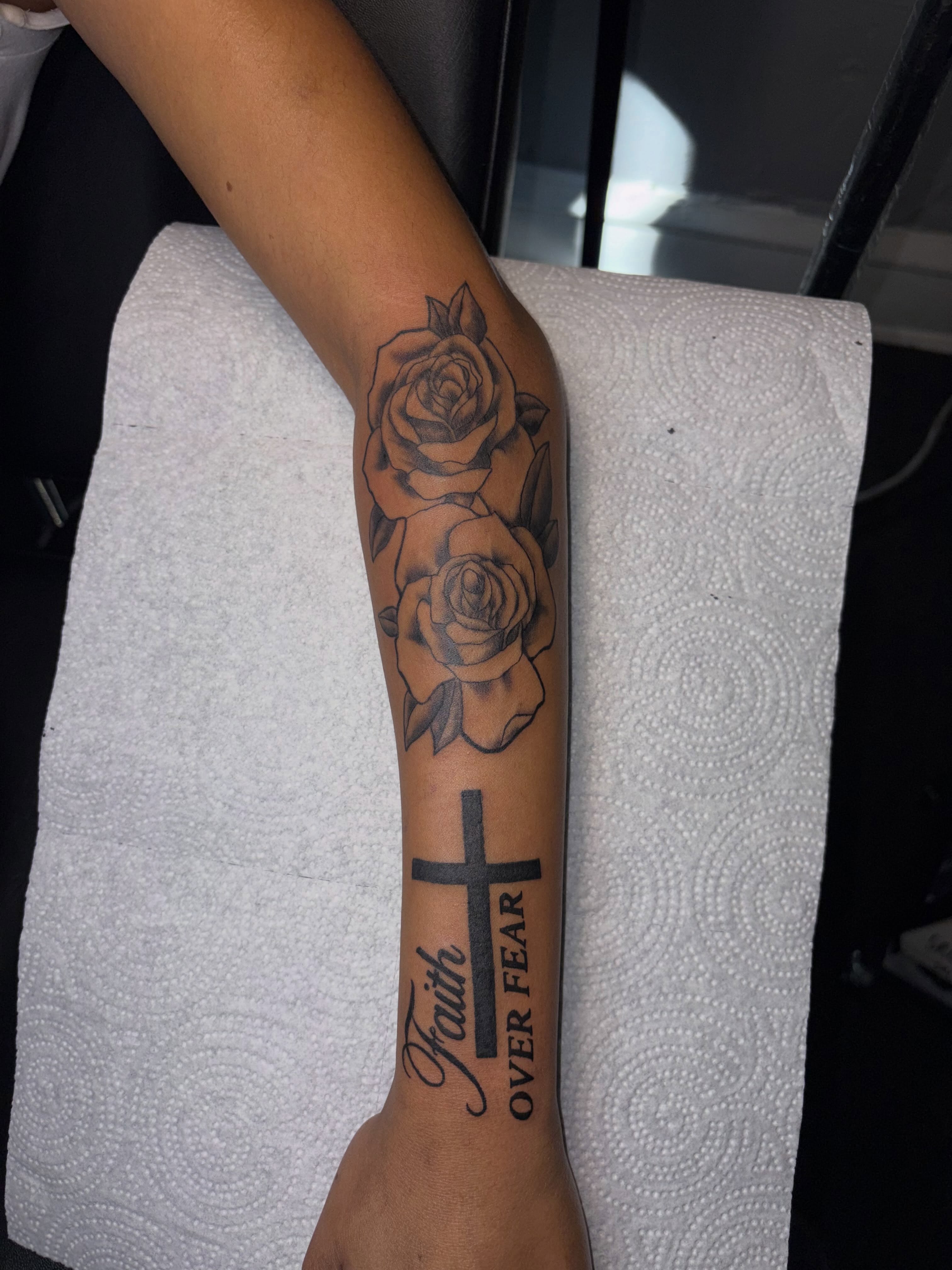 Roses and cross black and grey tattoo on the forearm by 216 Tattoos 🥰