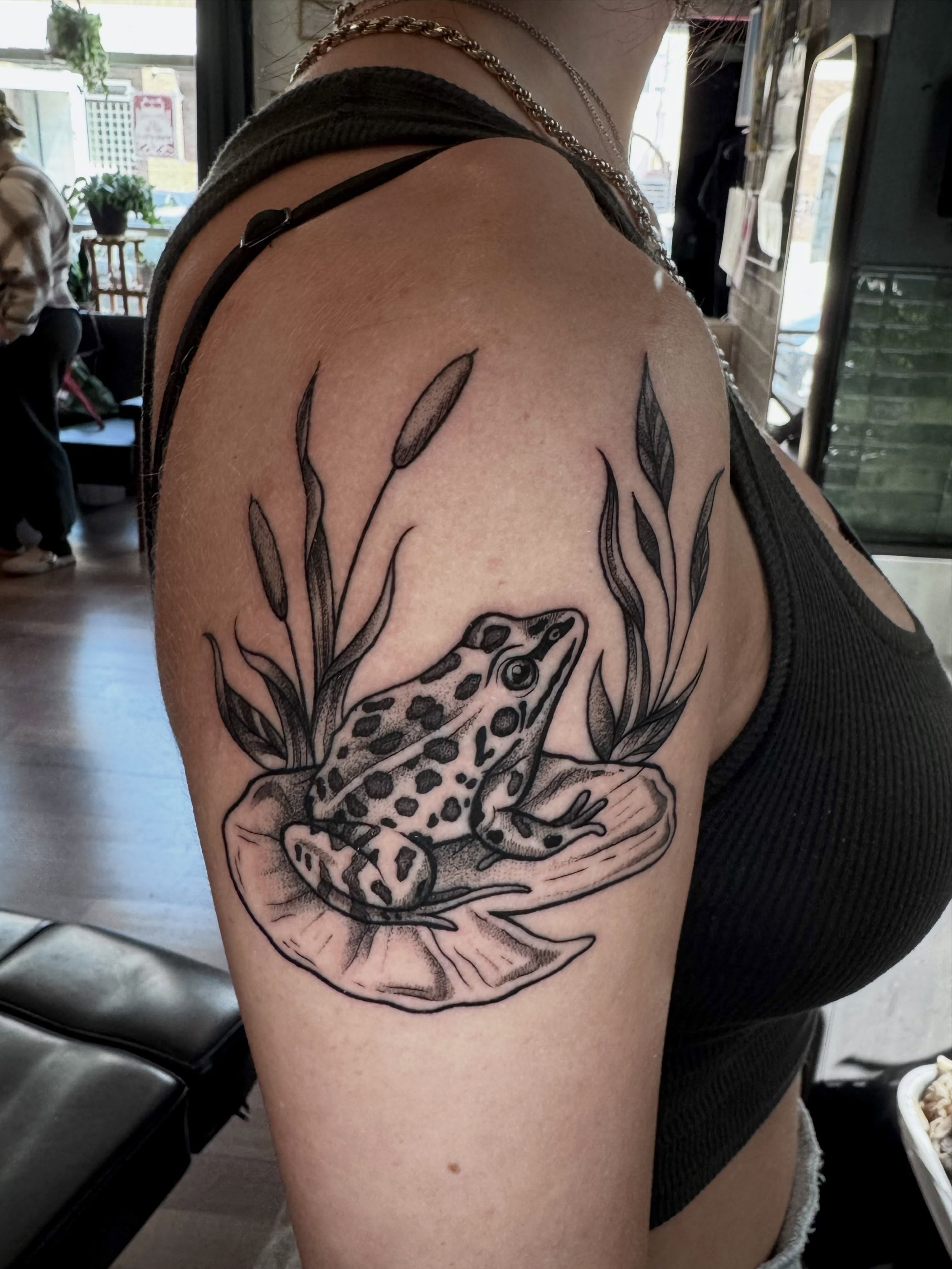Frog dotwork tattoo on the shoulder by Morgan Peeples