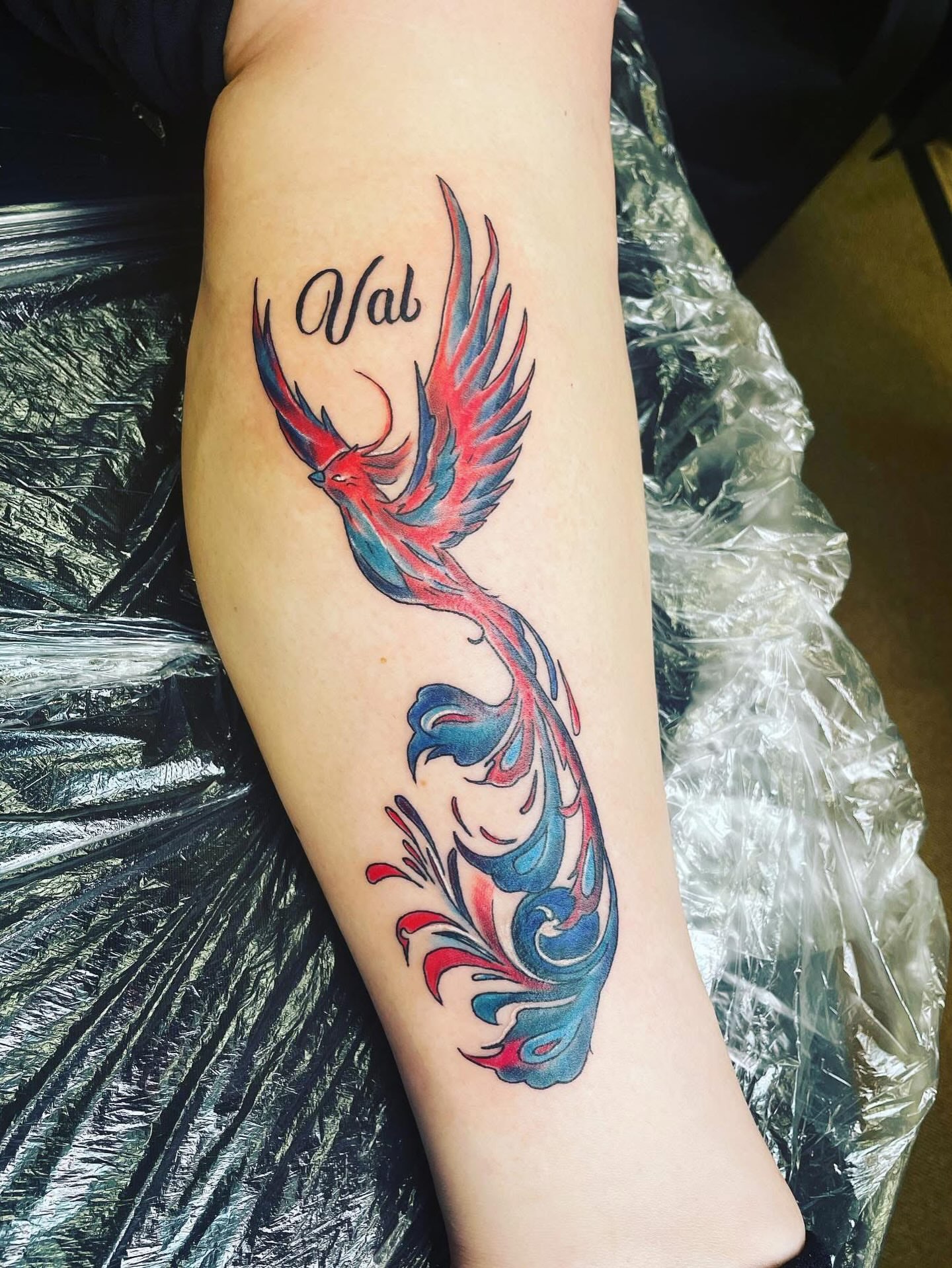 Phoenix new school tattoo on the forearm by Rain David