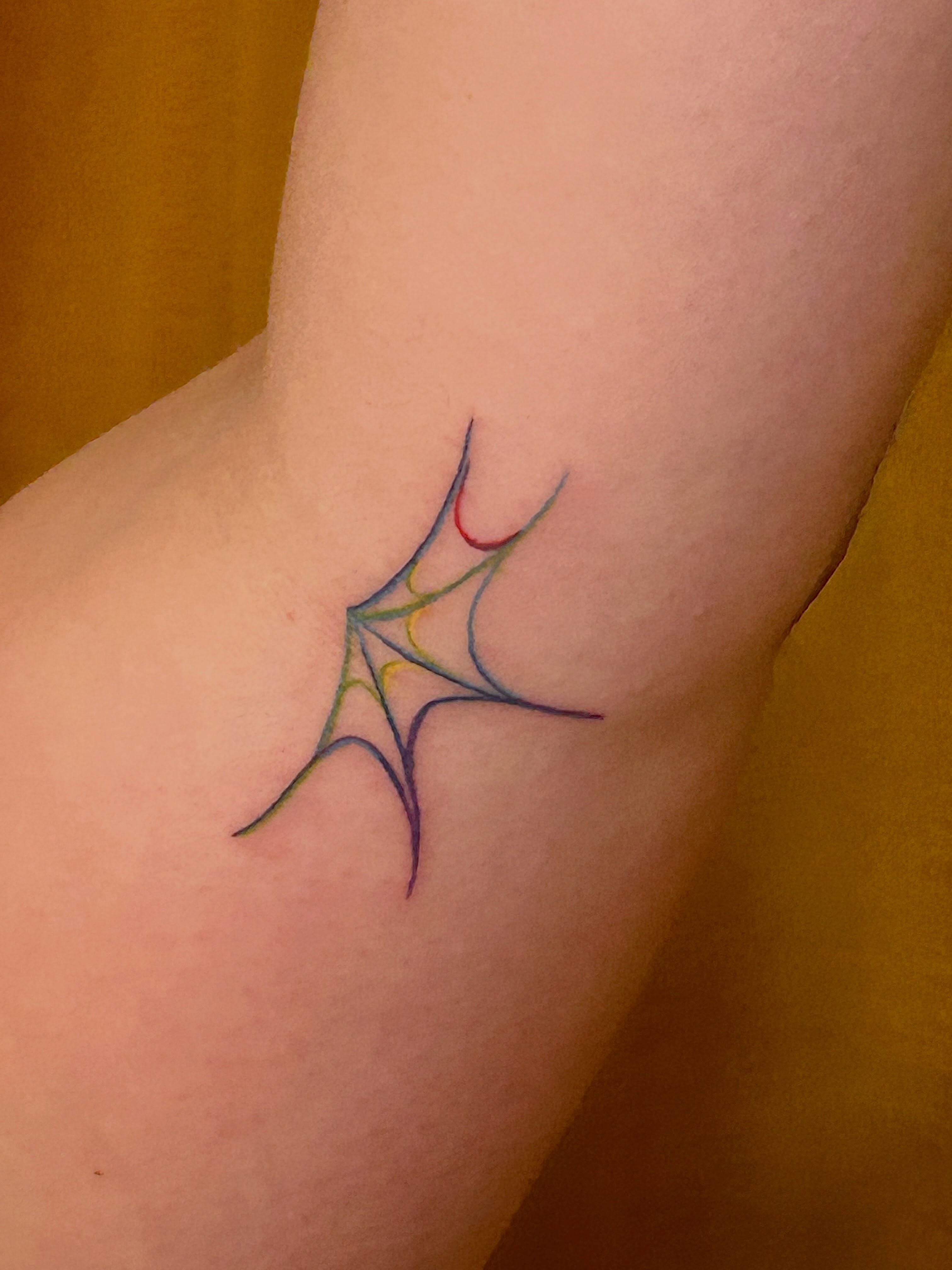 Spider web geometric tattoo on the forearm by Nicolette