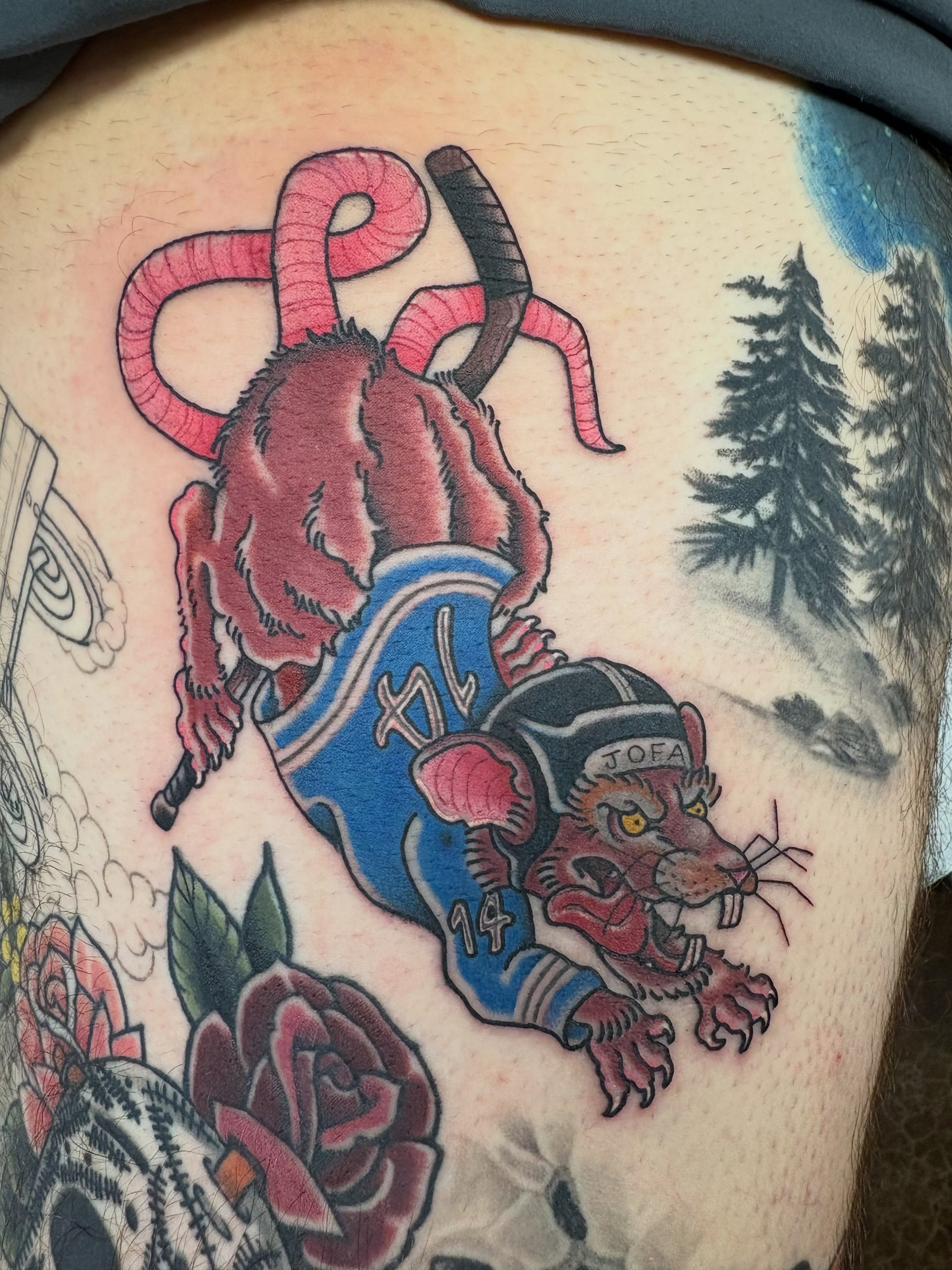 Panther and bull American traditional tattoo on the thigh by Jakob Ristau, Kansas City, Missouri