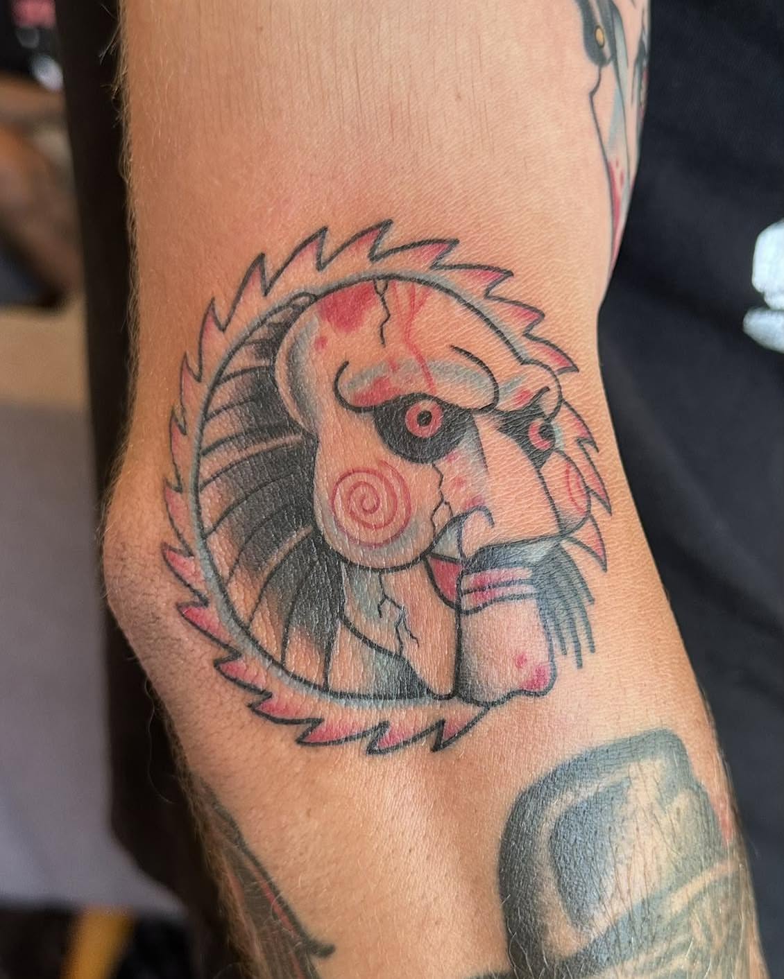 Lion American traditional tattoo on the forearm by Robert Morrow