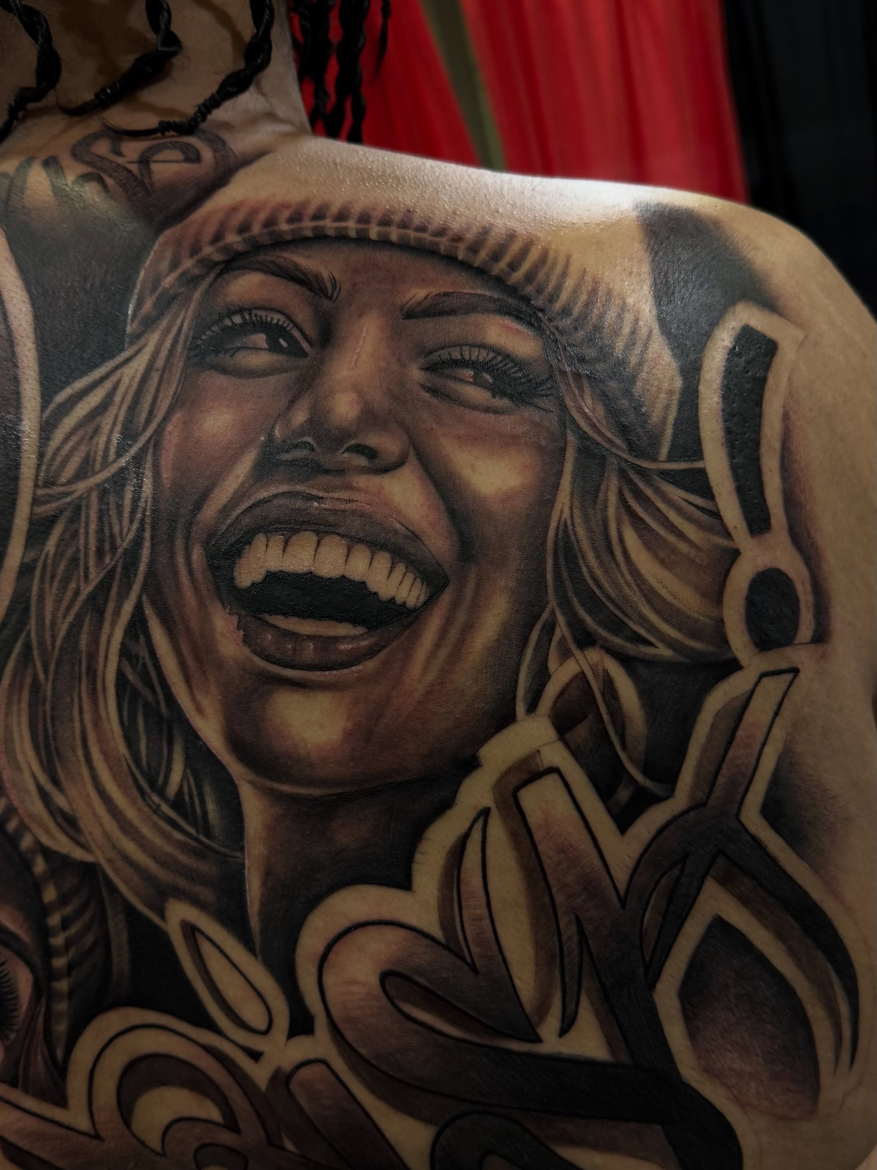 Woman laughing realism tattoo on the shoulder by Pablo Venegas