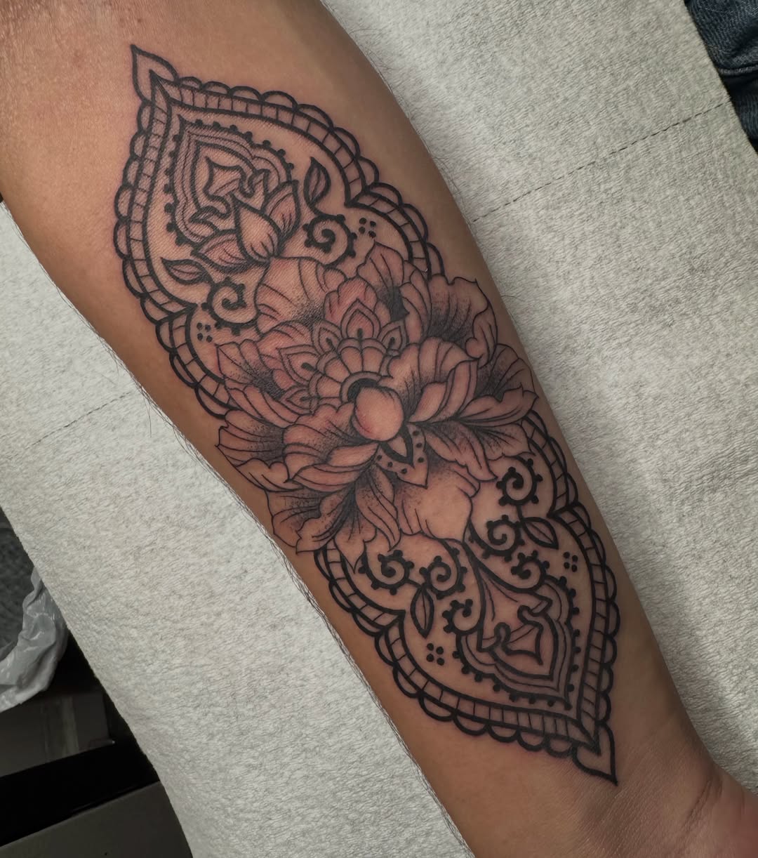 Floral mandala ornamental tattoo on the forearm by Lisa Nikolopoulos, New York, New York