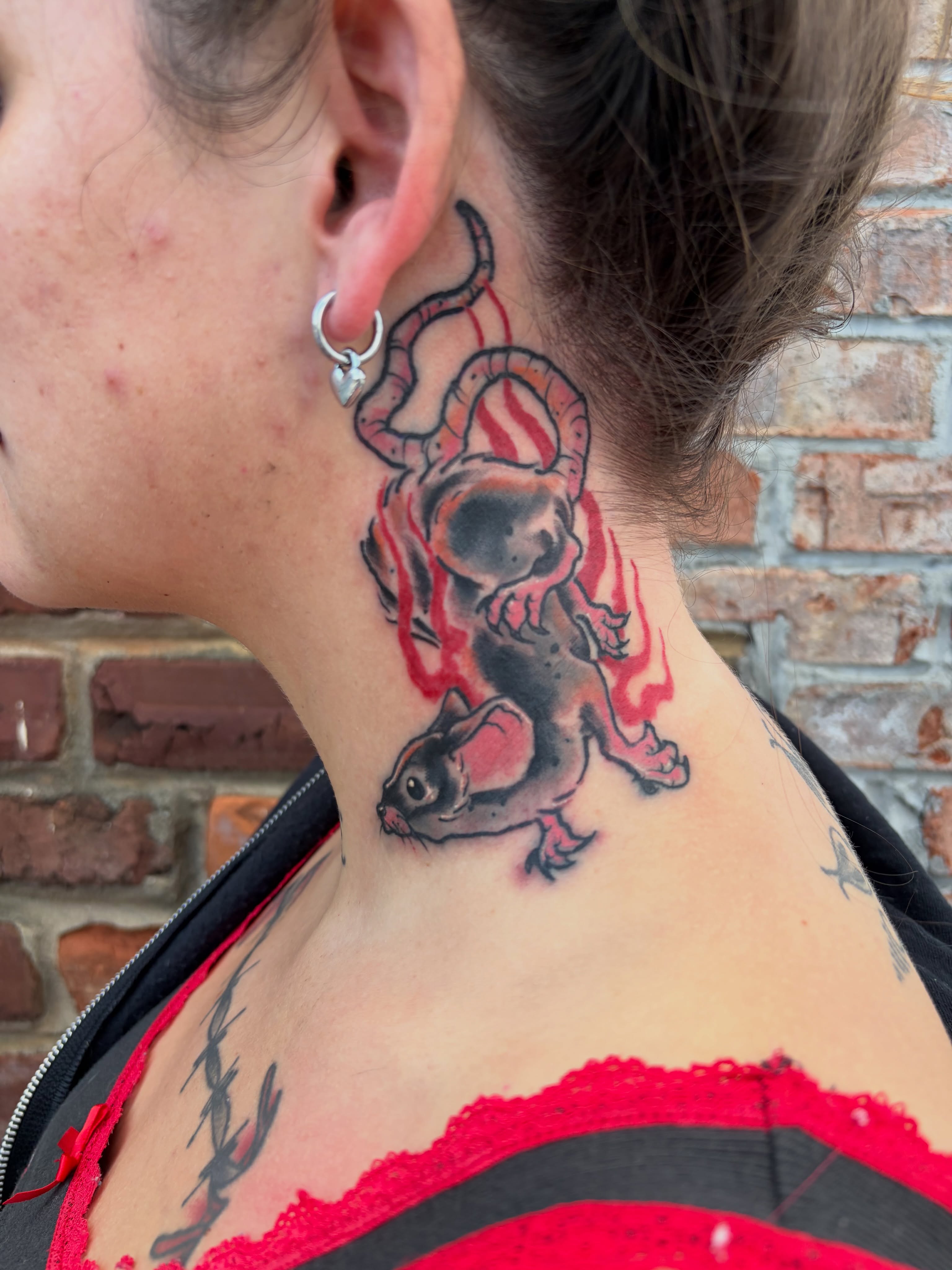 Cat and flames realism tattoo on the neck by Vudu Tattooer