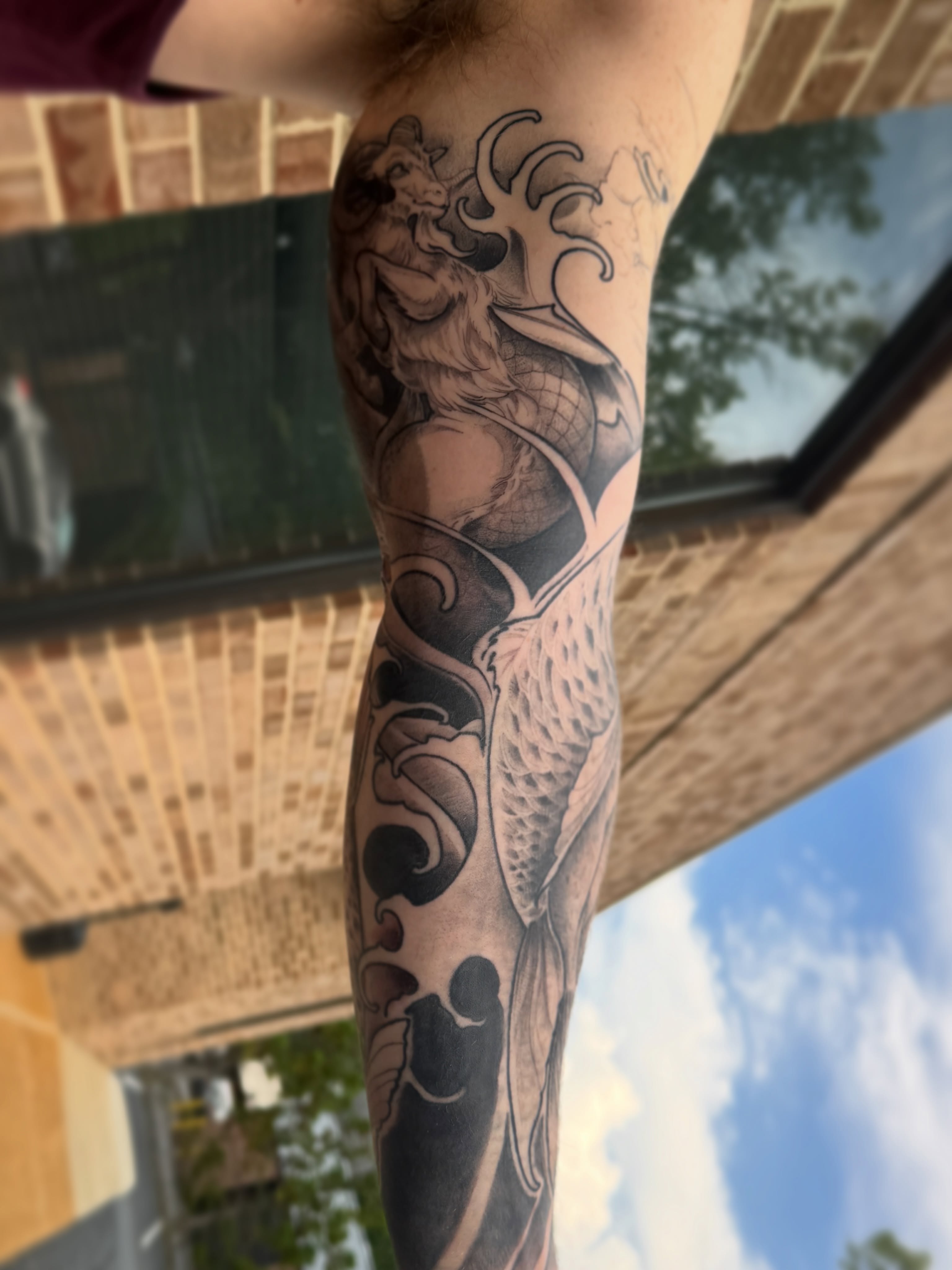 Merman realism tattoo on the forearm by Joe Hall