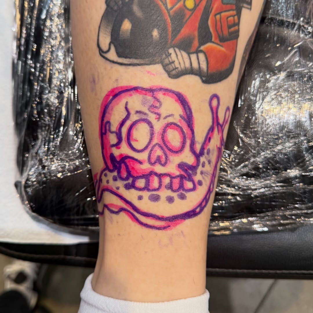 Skull trash polka tattoo on the forearm by Mercy Dean