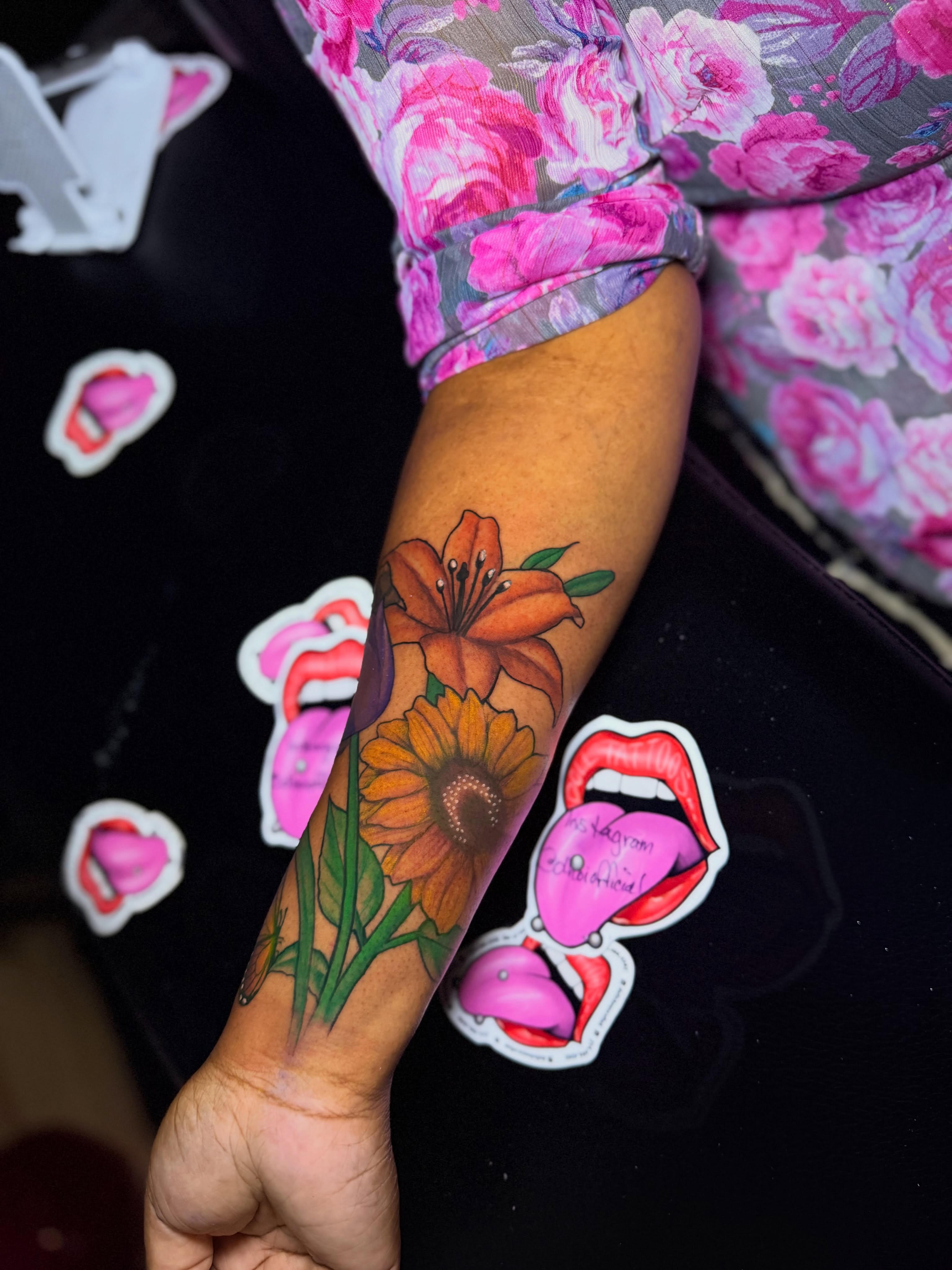 Lilies and sunflower realism tattoo on the forearm by Doll The Tattoo Artist, Addison, Texas